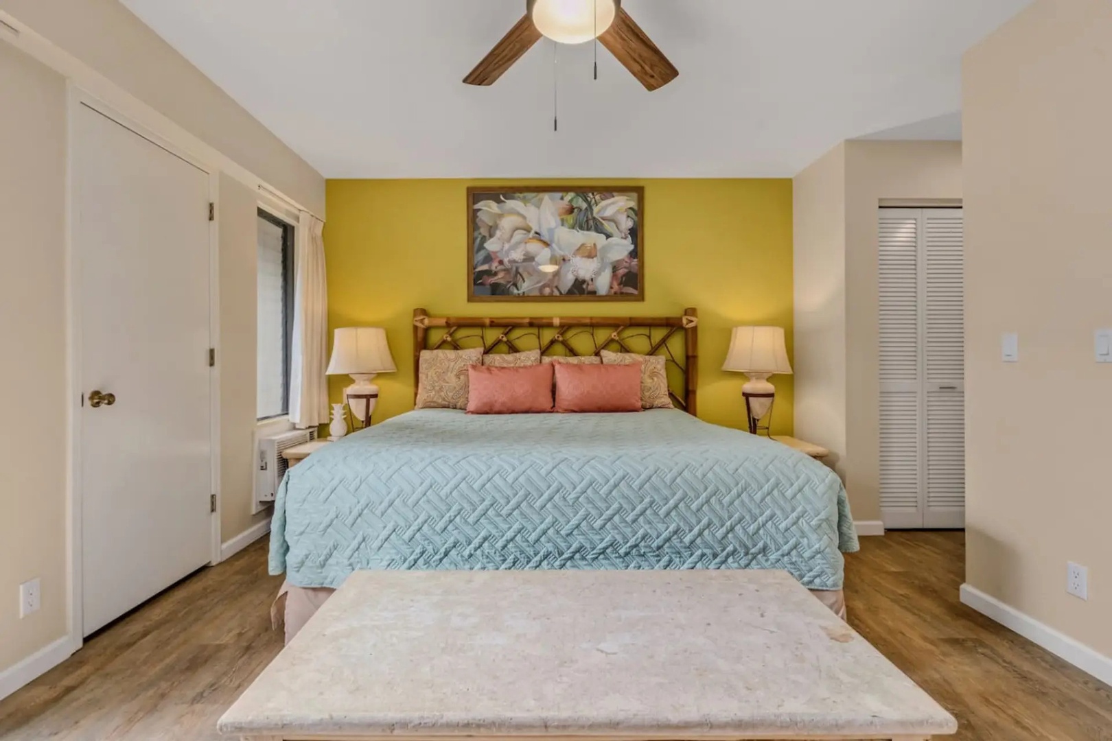Kihei Vacation Rentals, Maui Kamaole E103 - Wake up in the primary suite, where the ensuite bath is only a few feet from the bed.