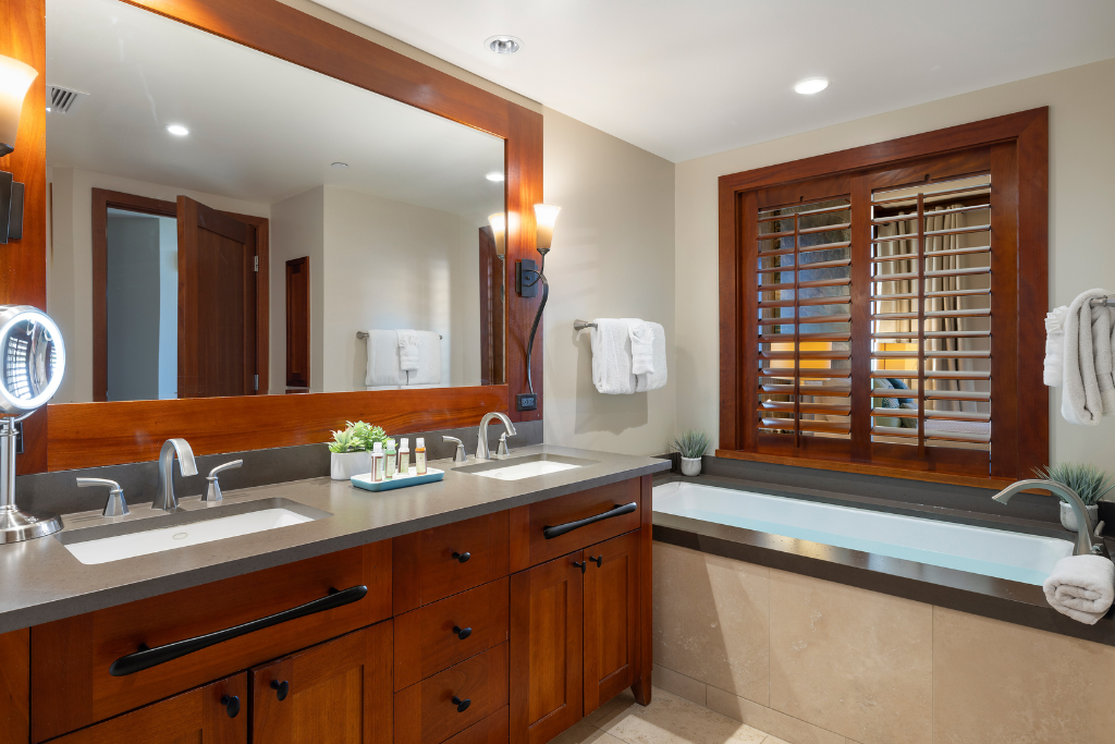 Kapolei Vacation Rentals, Ko Olina Beach Villas B109 - The large soaker tub, dual vanity and walk in shower provide primary ensuite luxury.