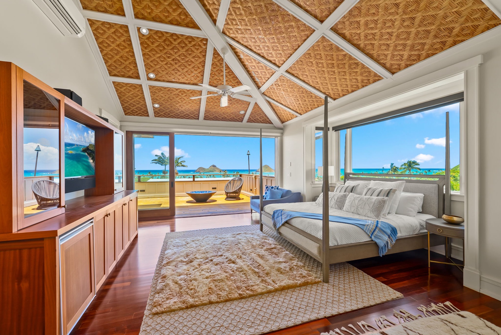 Kailua Vacation Rentals, Leaf House - Wake up to breathtaking turquoise waters and swaying palms framed by floor-to-ceiling windows. Your luxurious canopy bed awaits beneath a stunning woven ceiling, blending island elegance with coastal comfort.
