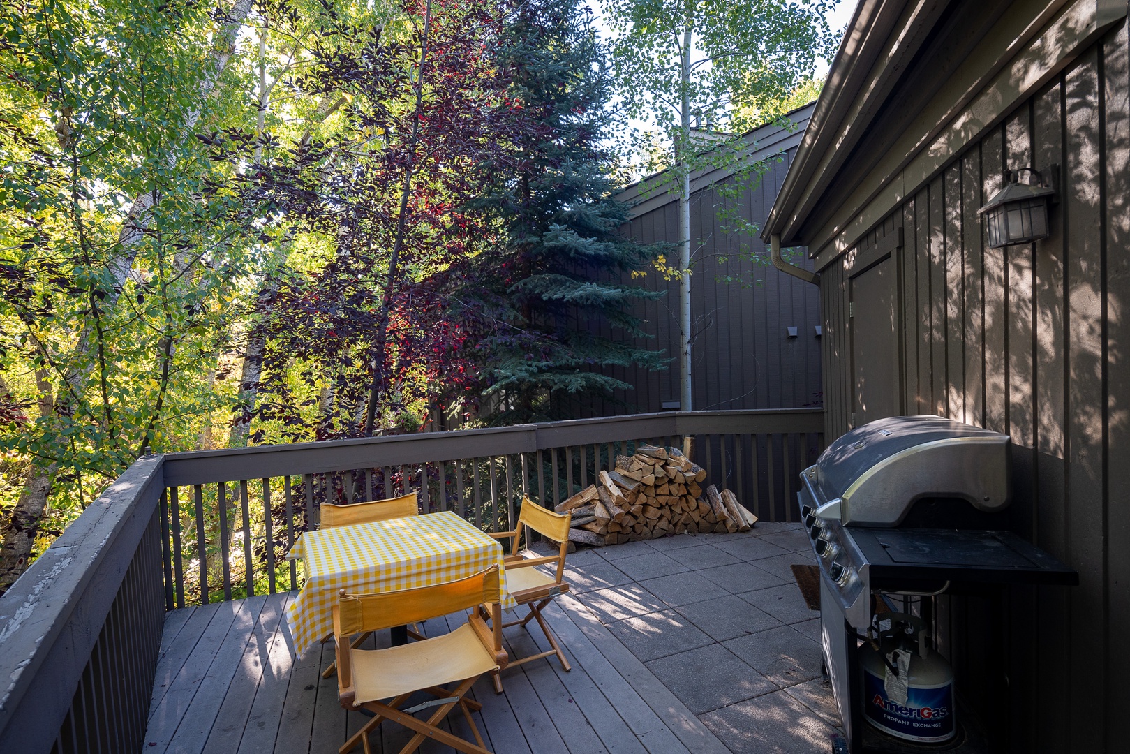 Ketchum Vacation Rentals, Bridgepoint Charm - On the deck, you'll also find a grill and outdoor dining area with seating for 3 and additional firewood