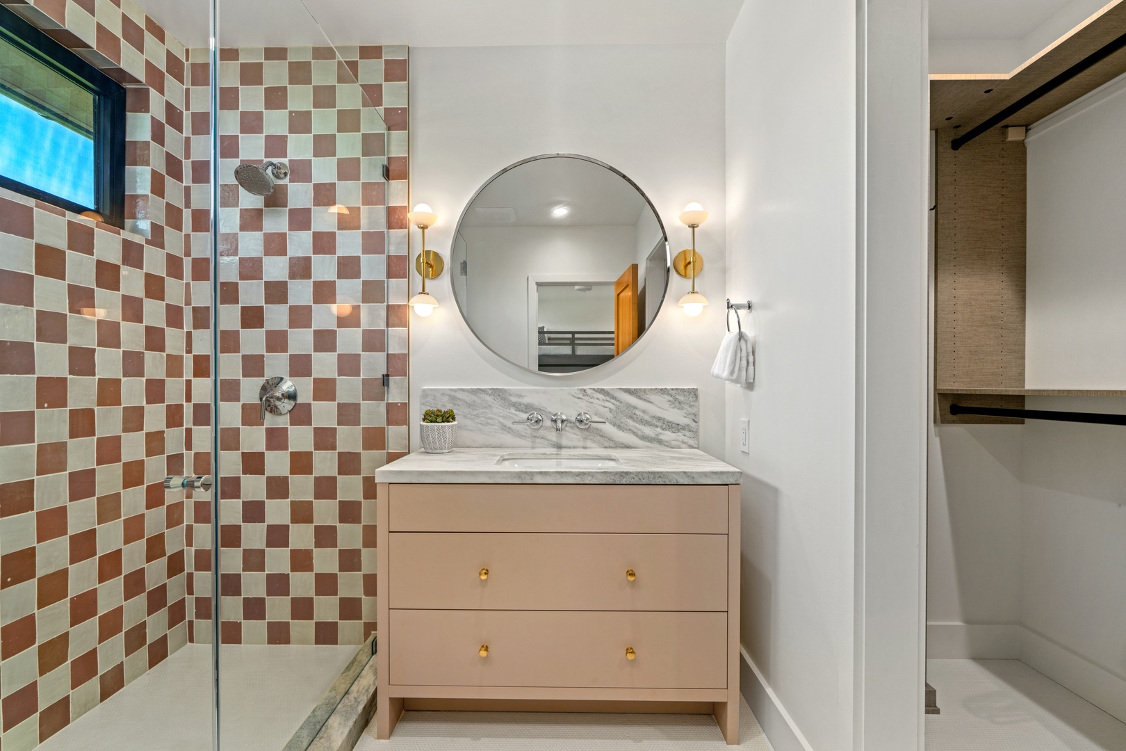 Koloa Vacation Rentals, Hale Laule'a at Kukui'ula - Your stylish bathroom features a stunning checkered tile shower and quartz vanity with golden accents for luxurious mornings.