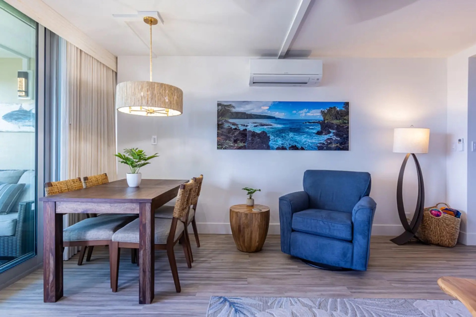 Kihei Vacation Rentals, Kamaole Beach Royal 610 - Soft curtains and a floor lamp warm the dining nook as evening light fades.