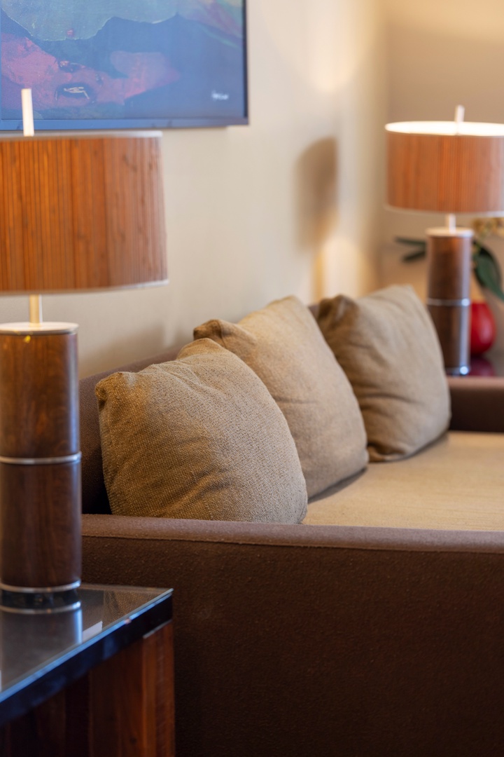 Sink into these plush cushions after a day of exploring. Warm ambient lighting and thoughtful details create your perfect retreat for unwinding with a book or planning tomorrow's adventures.