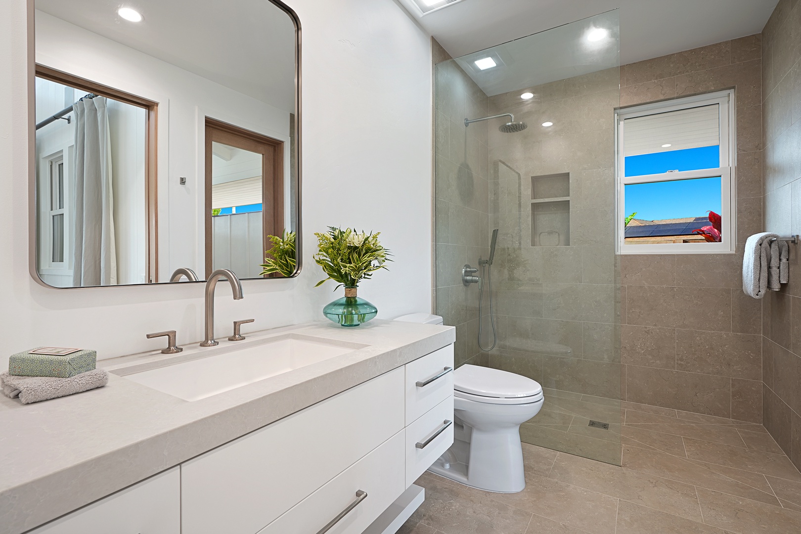 Koloa Vacation Rentals, Kaulu Hale at Kukuiula - The ensuite bathroom in guest suite 2 has a single vanity and a separate walk-in shower.