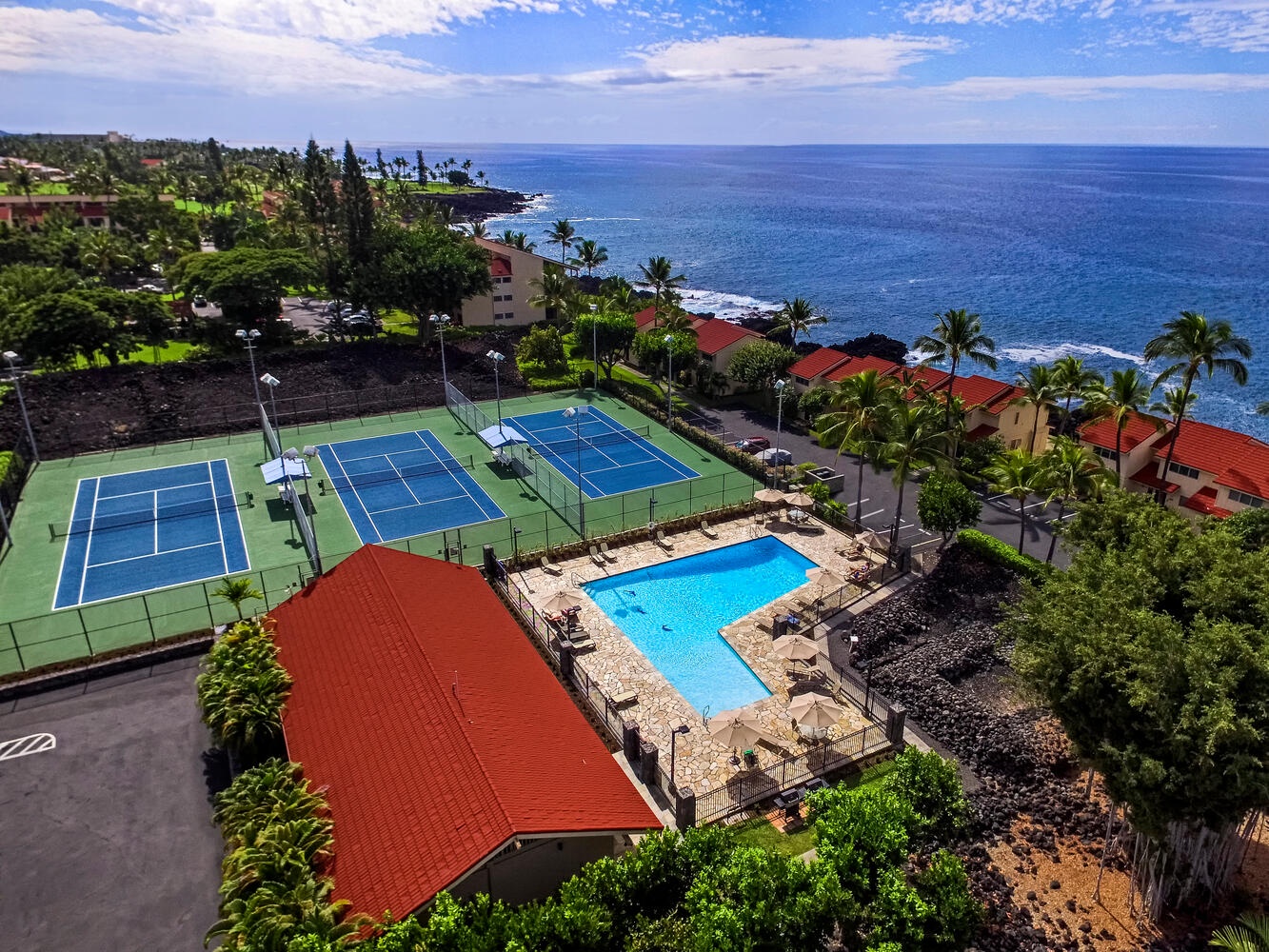 Kailua Kona Vacation Rentals, Keauhou Kona Surf & Racquet 1104 - Enjoy exclusive access to the vibrant condo clubhouse, complete with tennis courts for a friendly match, a ping pong table for indoor fun, and a sparkling pool for a refreshing swim.