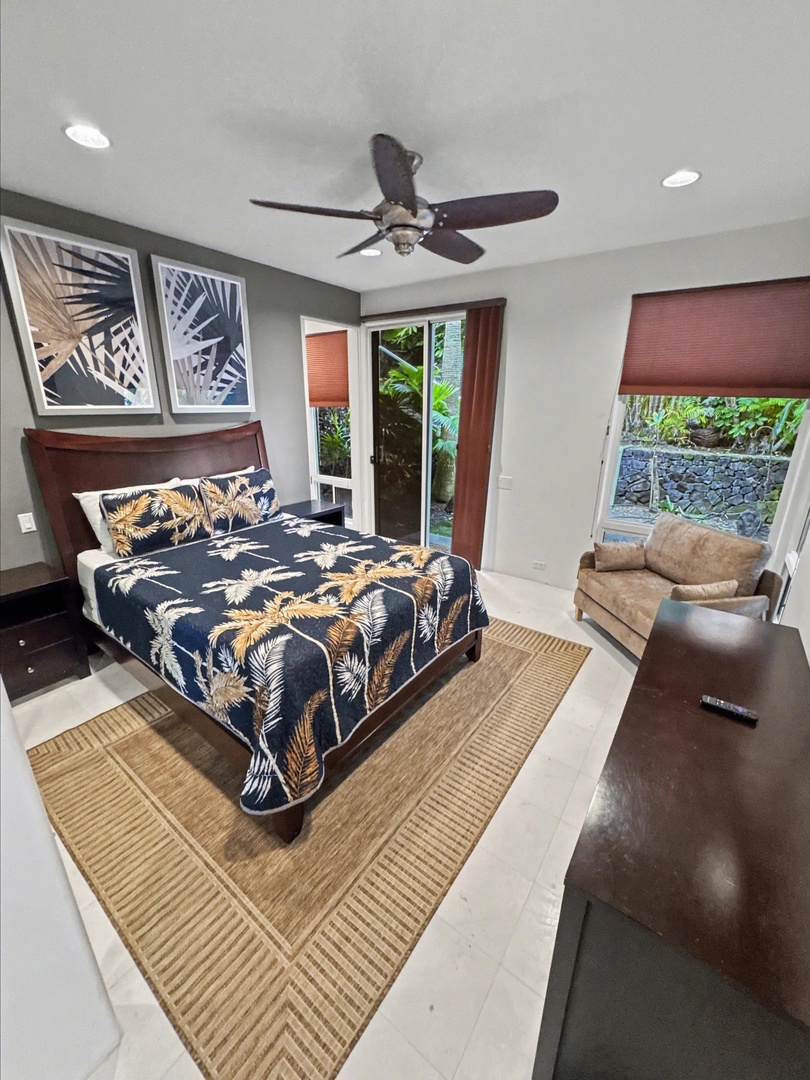 Kailua Kona Vacation Rentals, Hale Nai'a - Rest in your tropical-inspired bedroom with garden views and plush seating area for ultimate relaxation.