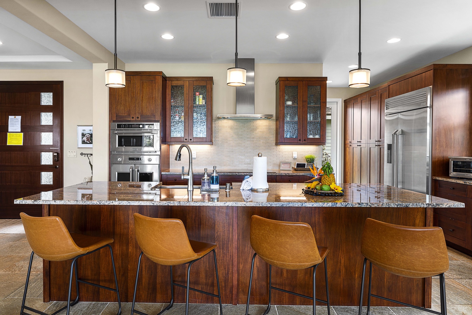 Kailua Kona Vacation Rentals, Holua Kai #27 - Prep dinner while the group gathers at the island on their leather stools.