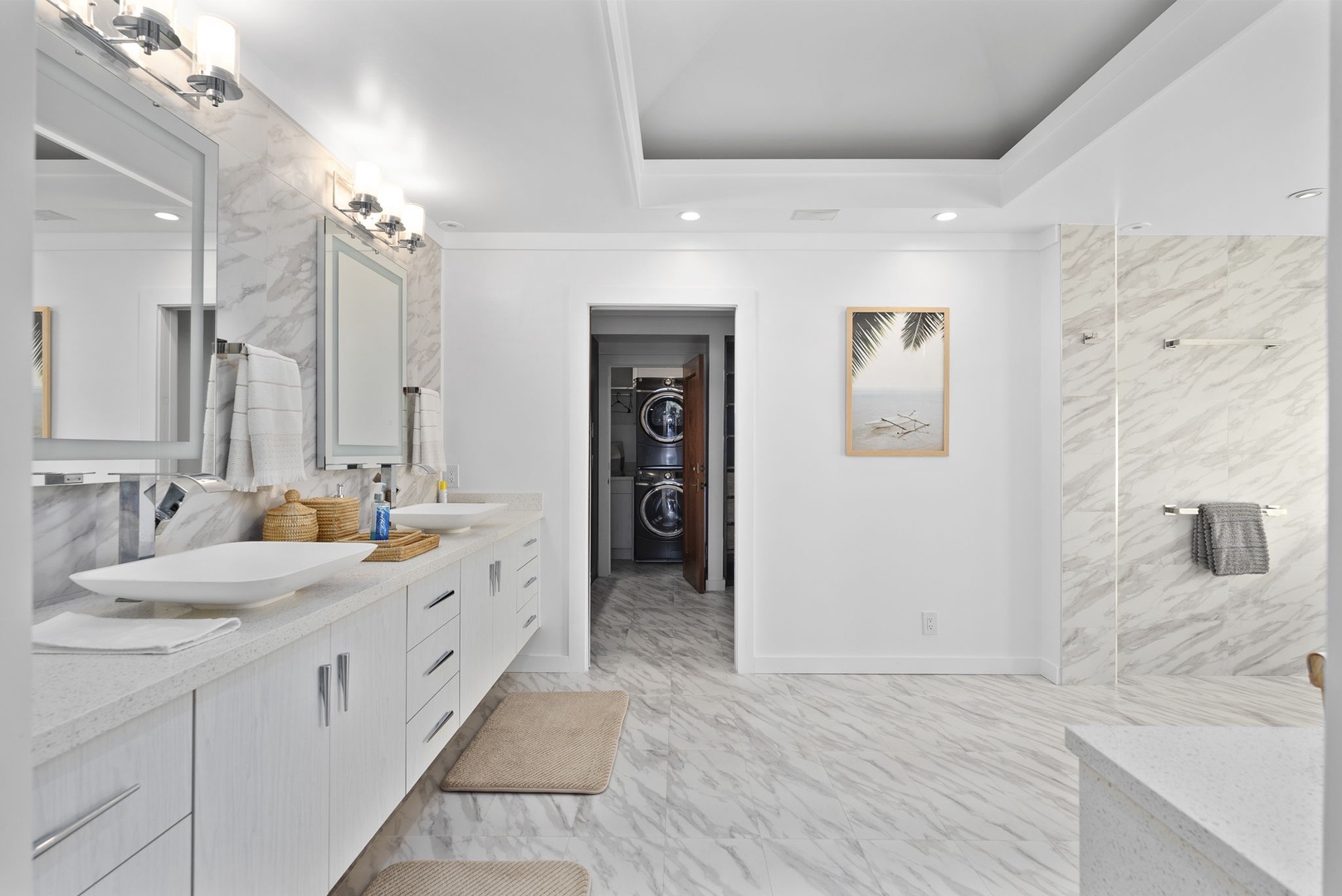 Honolulu Vacation Rentals, Honolulu Lagoonfront Villa - Dual vanities, marble floors, and spa-style touches make this ensuite bath a rejuvenating retreat.