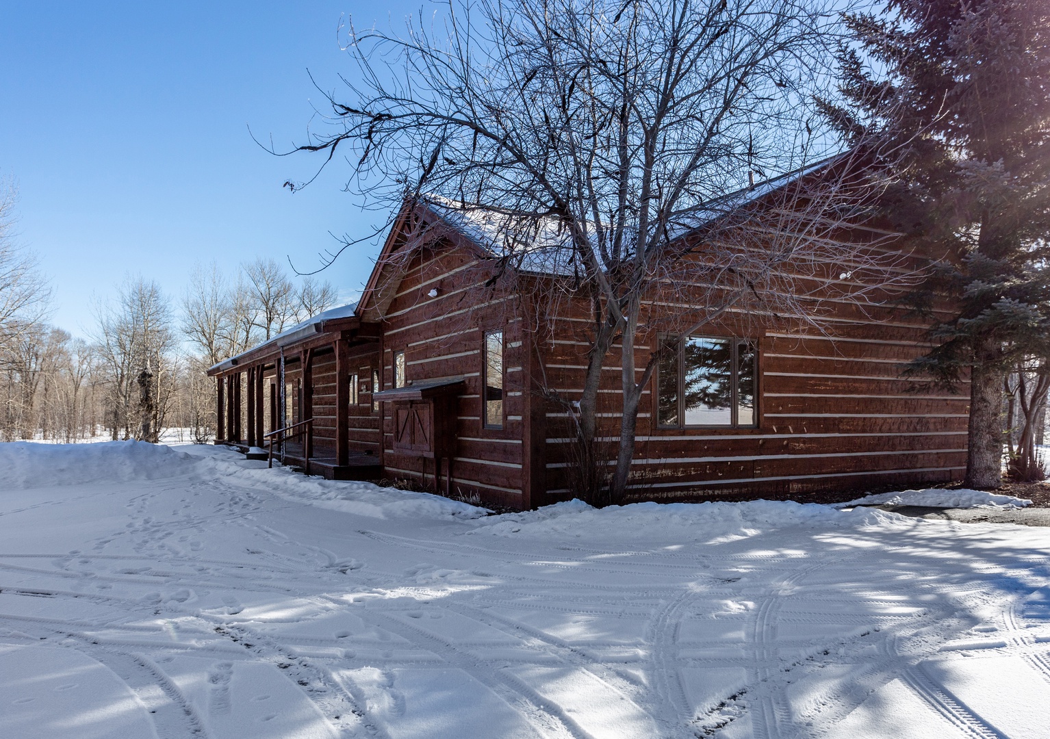 Bozeman Vacation Rentals, The Woodland Oasis - Winter snow makes this cabin even more magical