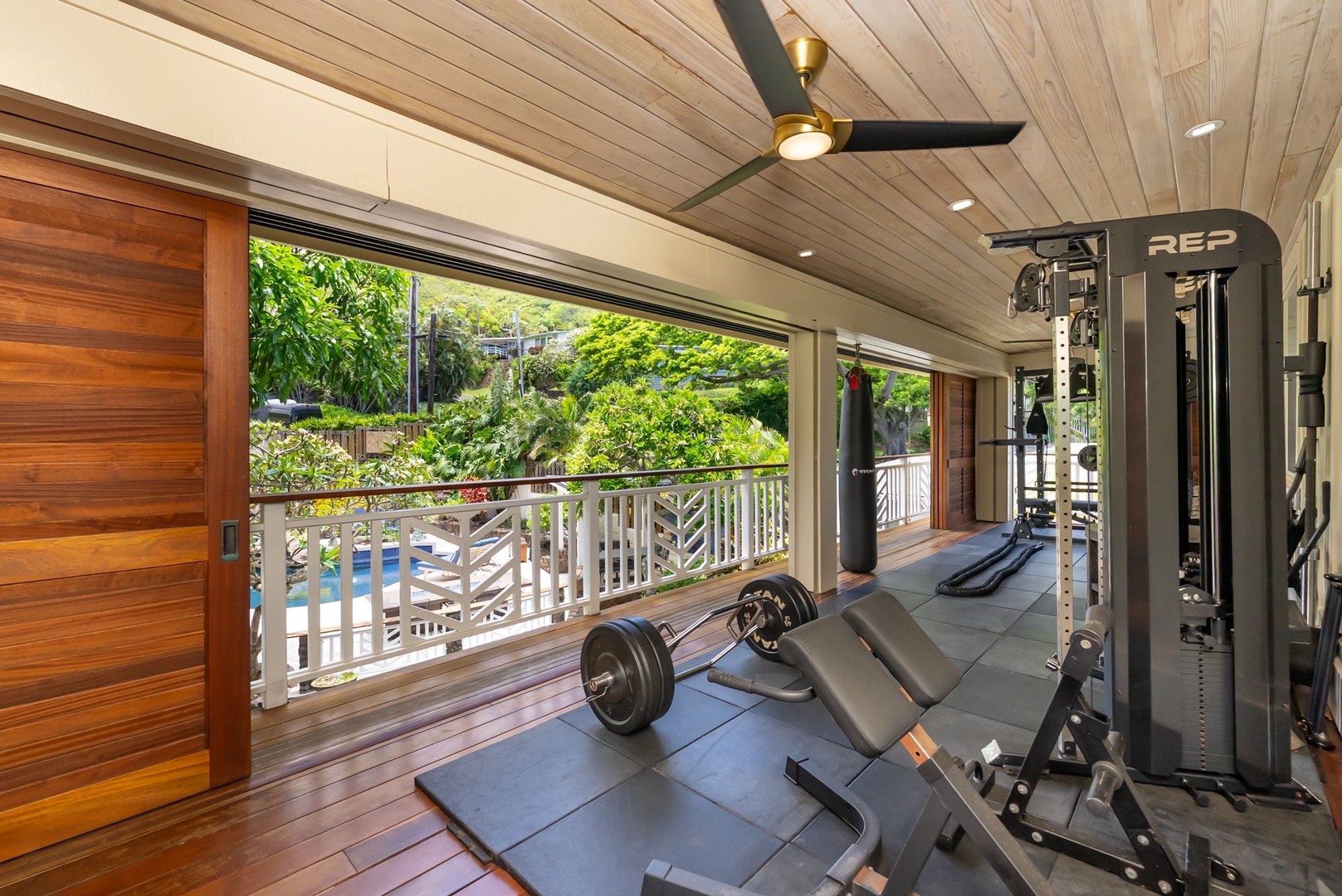 Kailua Vacation Rentals, Leaf House - Stay fit while you soak in tropical garden views from your private workout space, complete with professional equipment and ceiling fan to keep you cool.