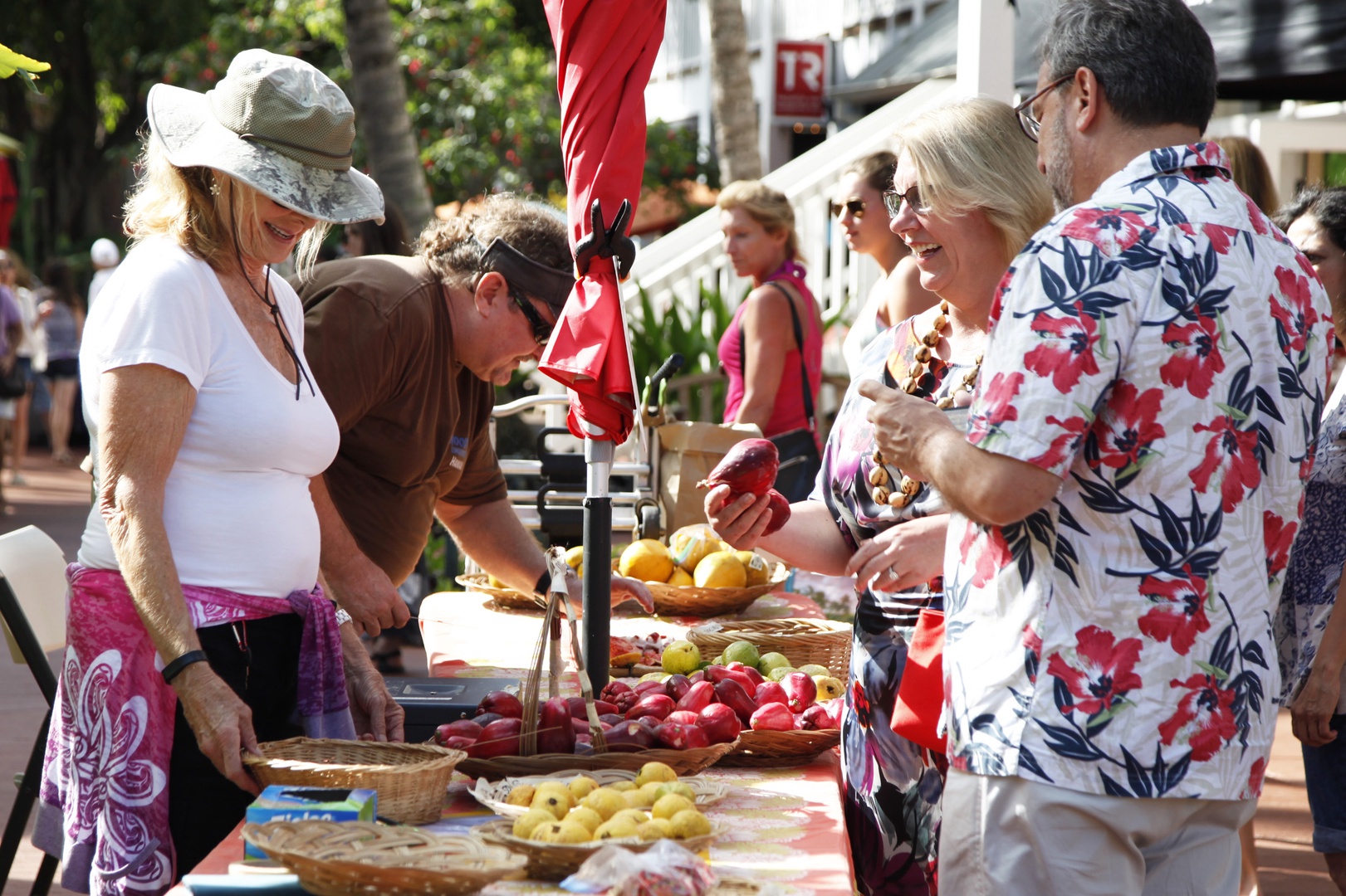 Koloa Vacation Rentals, Hale Kai'Opua - Bustling scene at Poipu Farmers Market filled with vibrant local goods.