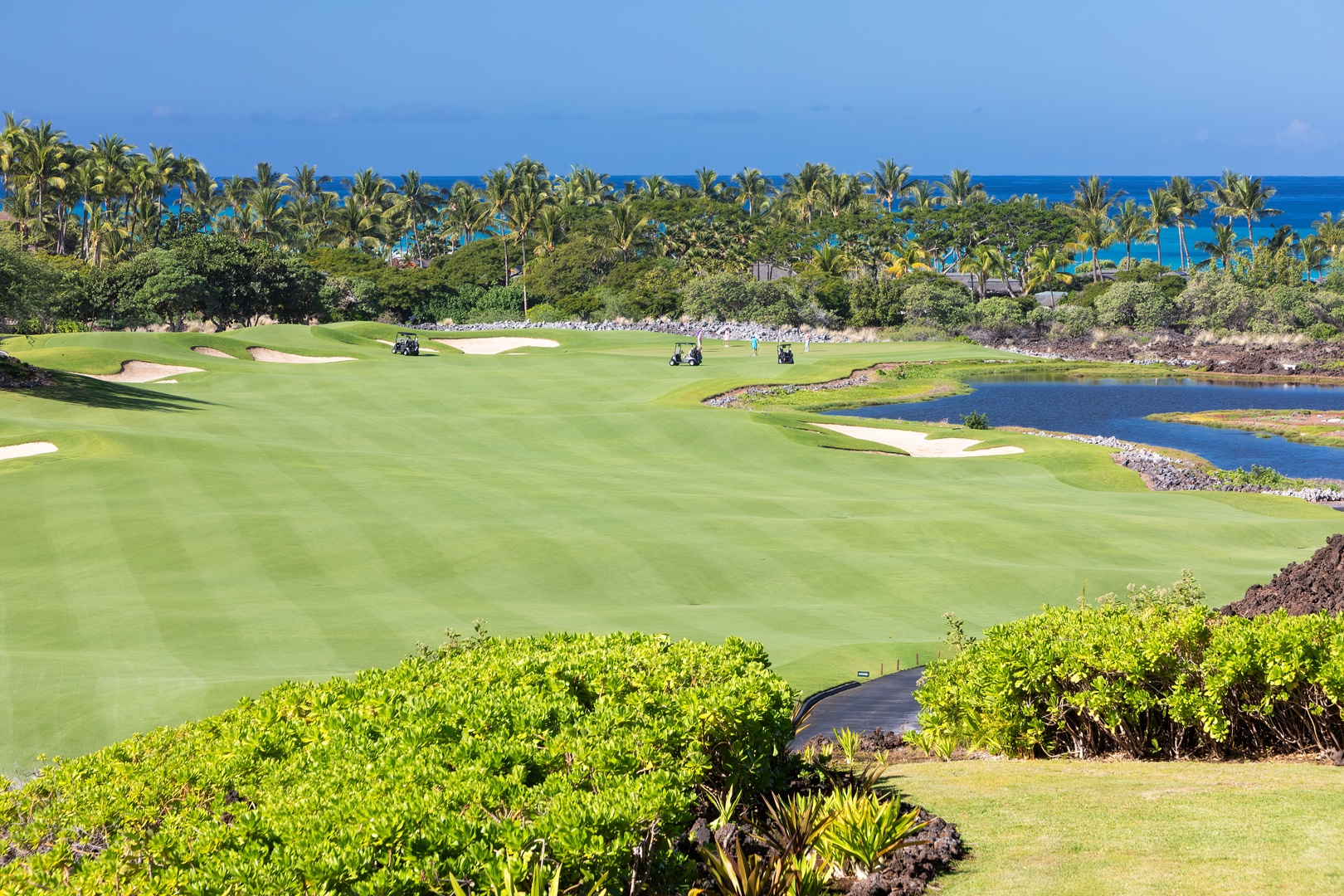 Kailua Kona Vacation Rentals, 3BD Waiulu Villa 111D at Hualalai Resort - Expansive golf course views framed by lush greenery and the ocean beyond.