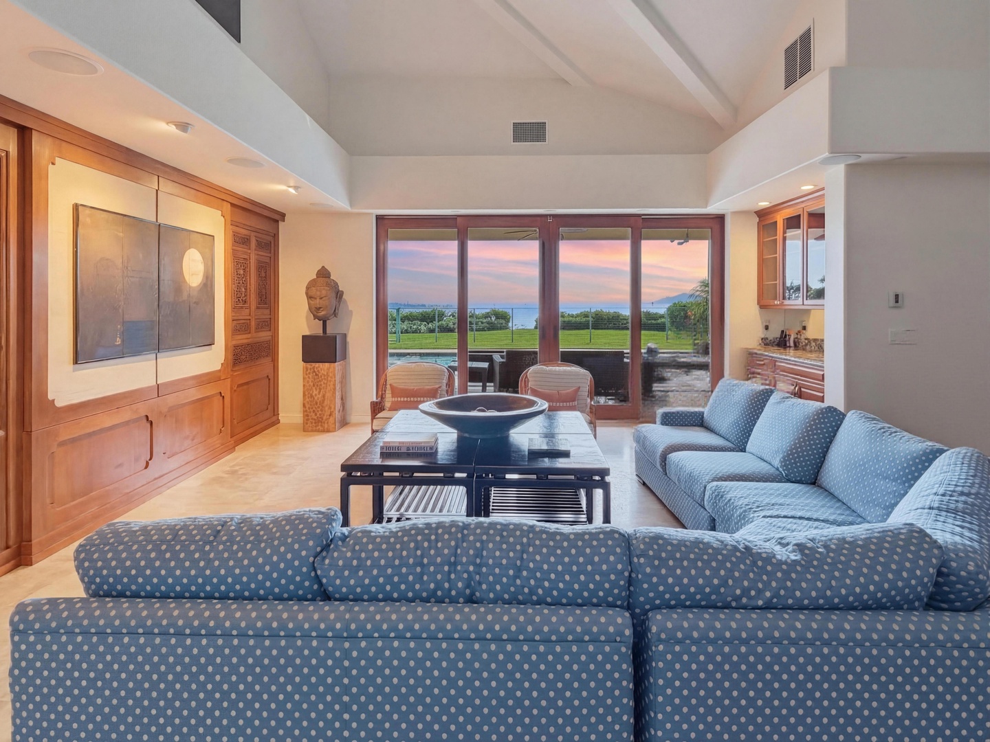 Honolulu Vacation Rentals, Maunalua Estate - Sink into plush sofas while ocean breezes flow through floor-to-ceiling windows, creating your perfect tropical retreat.