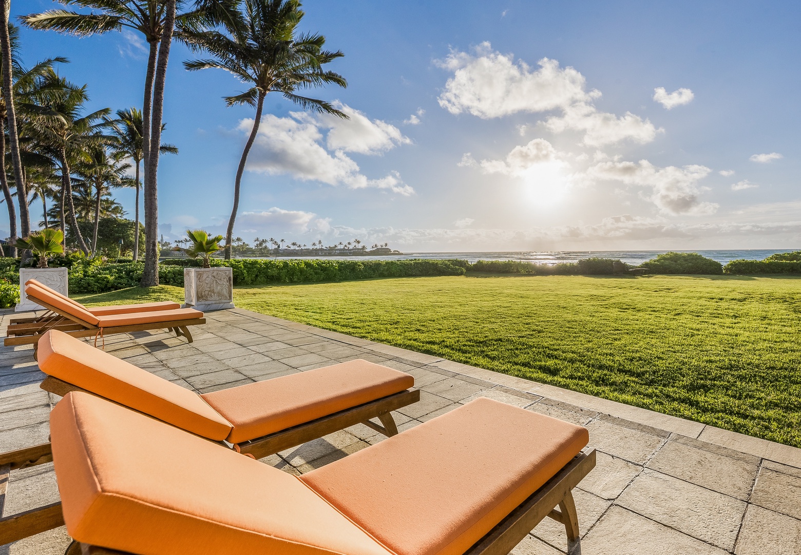 Kailua Vacation Rentals, Castle Point Estate - Bask in ocean glimpses and garden serenity from lounge chairs on the terrace.