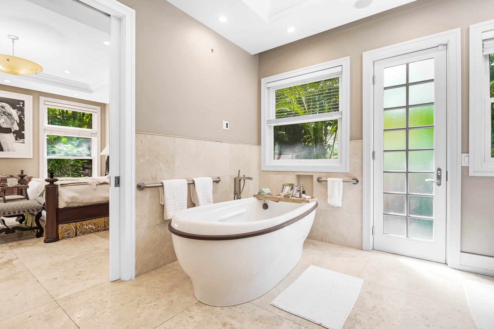 Honolulu Vacation Rentals, Pili Pono - Modern bathroom with a deep soaking tub and natural light.