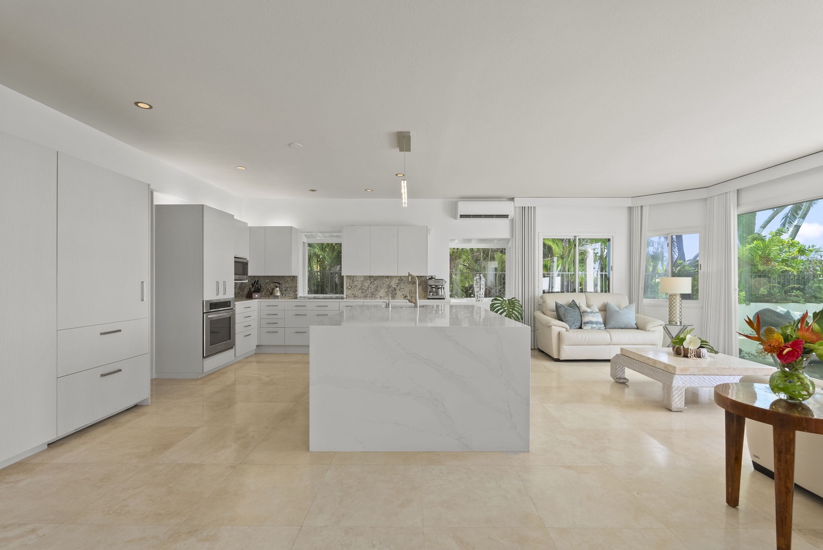 Honolulu Vacation Rentals, Paradise Beach Estate - This entertainer’s kitchen flows into a luminous living area, combining modern design with effortless comfort.