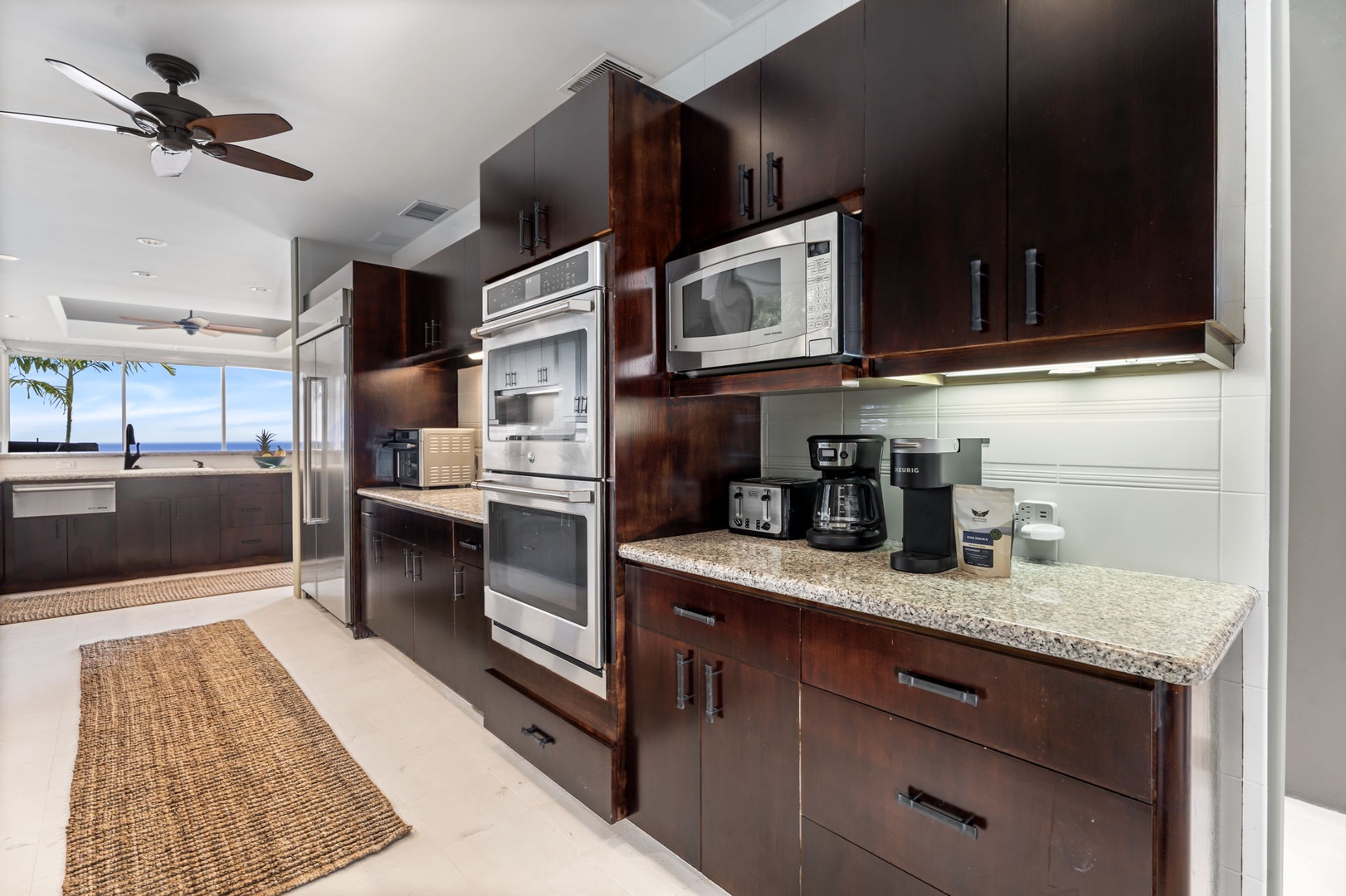 Kailua Kona Vacation Rentals, Hale Nai'a - Your gourmet kitchen features granite counters, stainless appliances, and coffee facilities—perfect for preparing meals while enjoying ocean views.