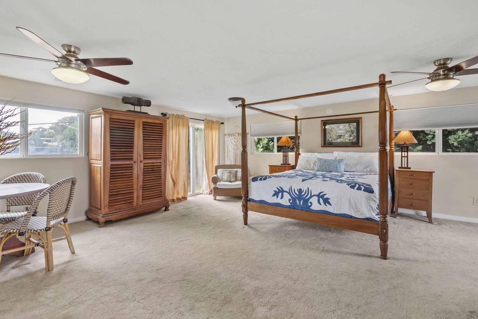 Haleiwa Vacation Rentals, North Shore Beachfront Retreat - Spacious guest bedroom suite with a king-size bed and outdoor access.