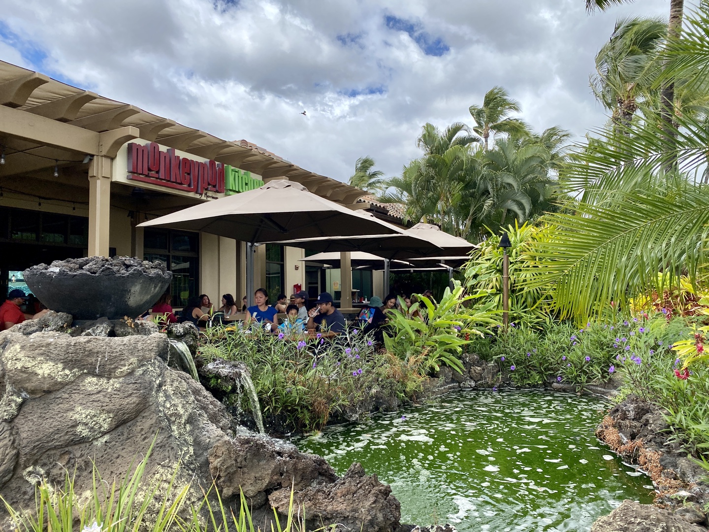 Kihei Vacation Rentals, Wailea Ekolu 1605 - A relaxing outdoor dining area with a peaceful garden view, perfect for enjoying a meal or coffee.