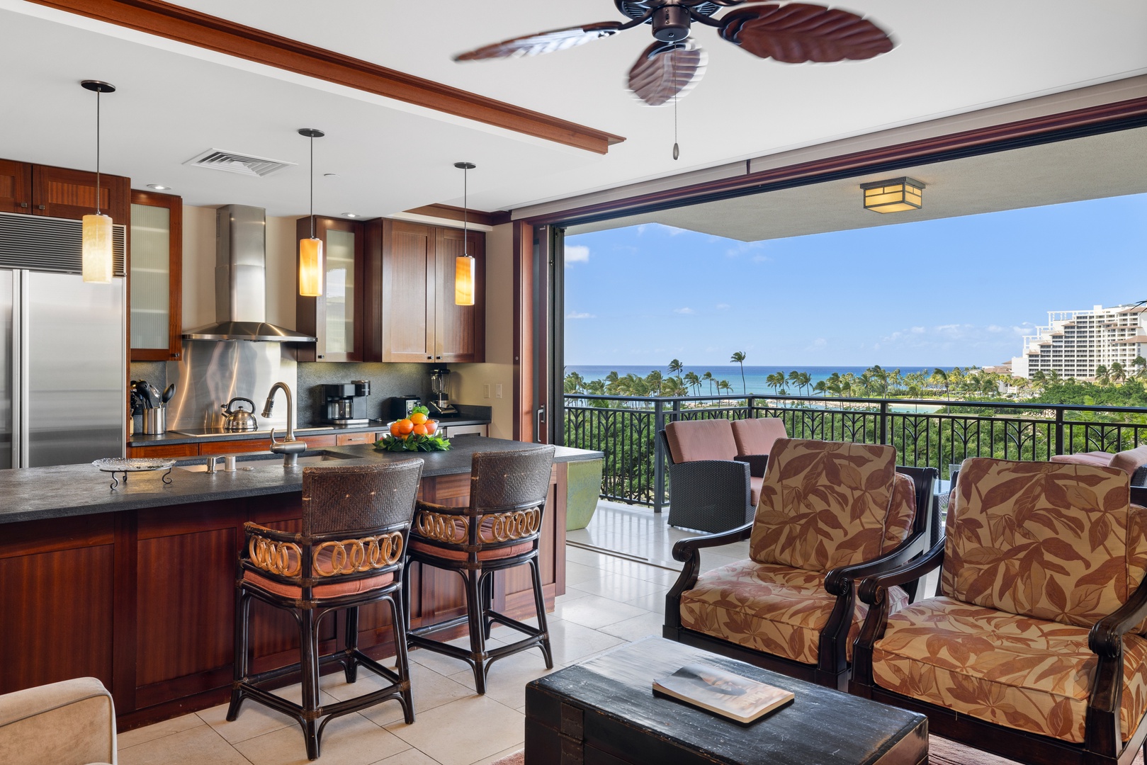 Kapolei Vacation Rentals, Ko Olina Beach Villas B602 - Enjoy the sea breezes in the open floor plan with bar seating in the kitchen.