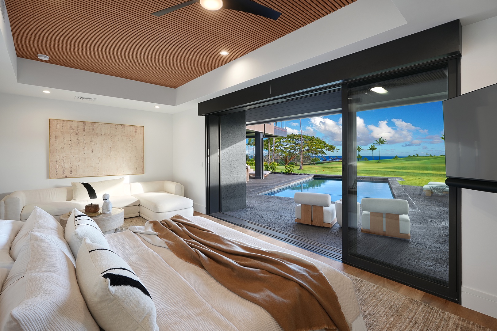 Koloa Vacation Rentals, Hale O Ka Nene - Relax in your luxurious primary suite with a plush king bed, where warm wood ceilings and soft textures invite peaceful mornings.