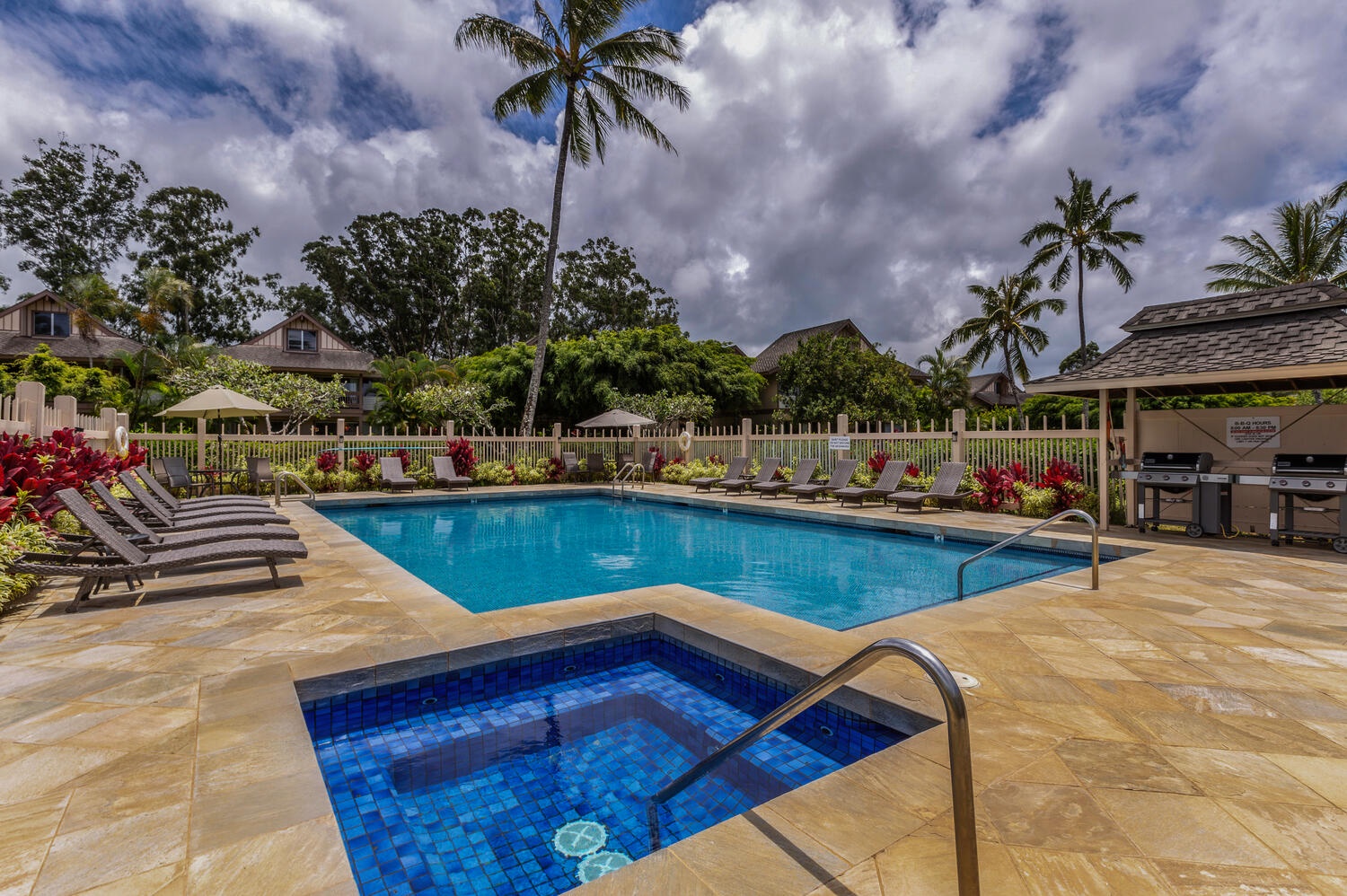 Princeville Vacation Rentals, Hideaway Haven Suite - Take a refreshing dip in the pool under the radiant Hawaiian sun—a true tropical delight.