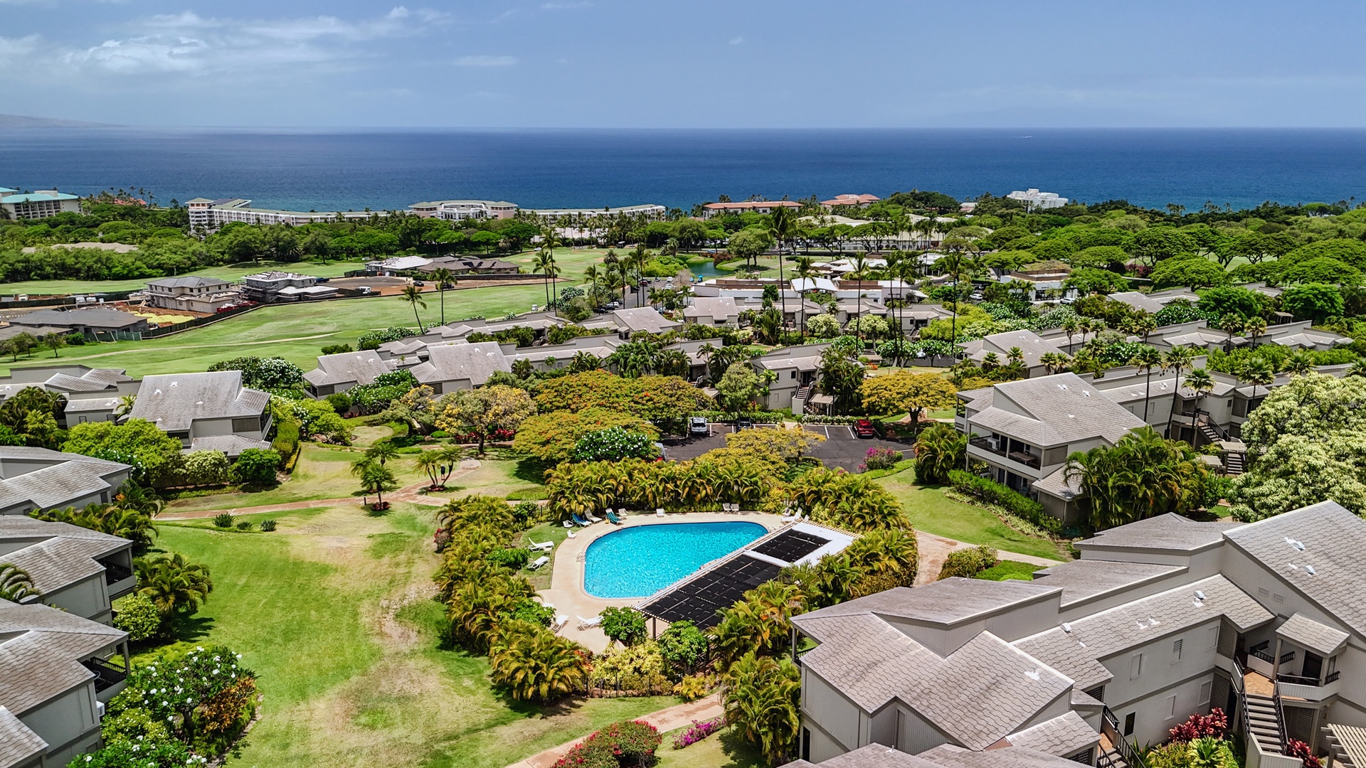 Kihei Vacation Rentals, Wailea Ekolu 204 - From above, the whole complex unfolds in green, the pool tucked in the trees and the Wailea coastline stretching out to the water beyond.