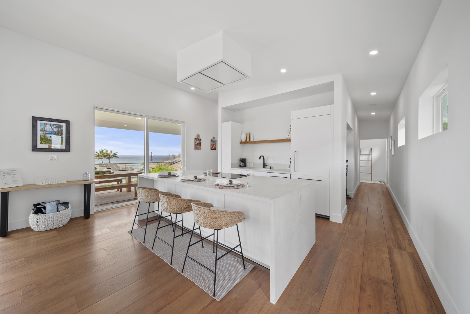 Haleiwa Vacation Rentals, Villa Bianca - Cook and connect in the fully stocked kitchen with island seating for three.