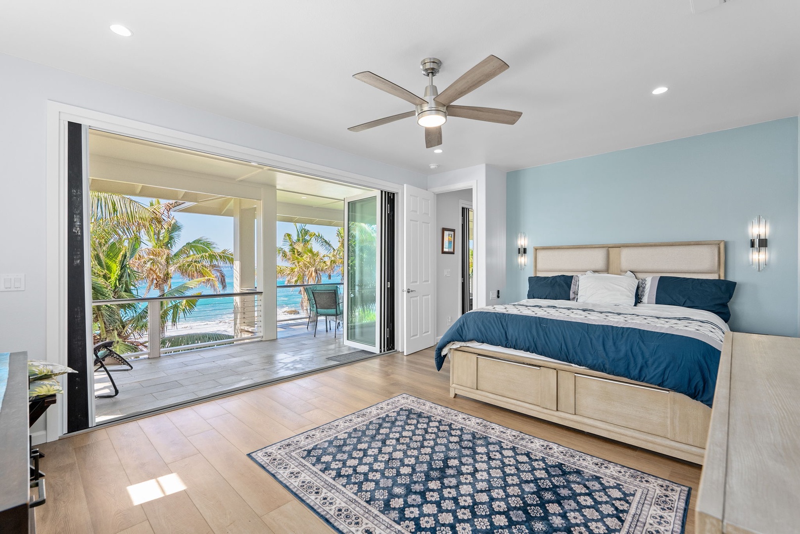 Waianae Vacation Rentals, Oceanfront Luxury Dream Estate - Oceanfront upstairs guest suite with a king-sized bed, direct lanai access and panoramic views beyond the glass doors.