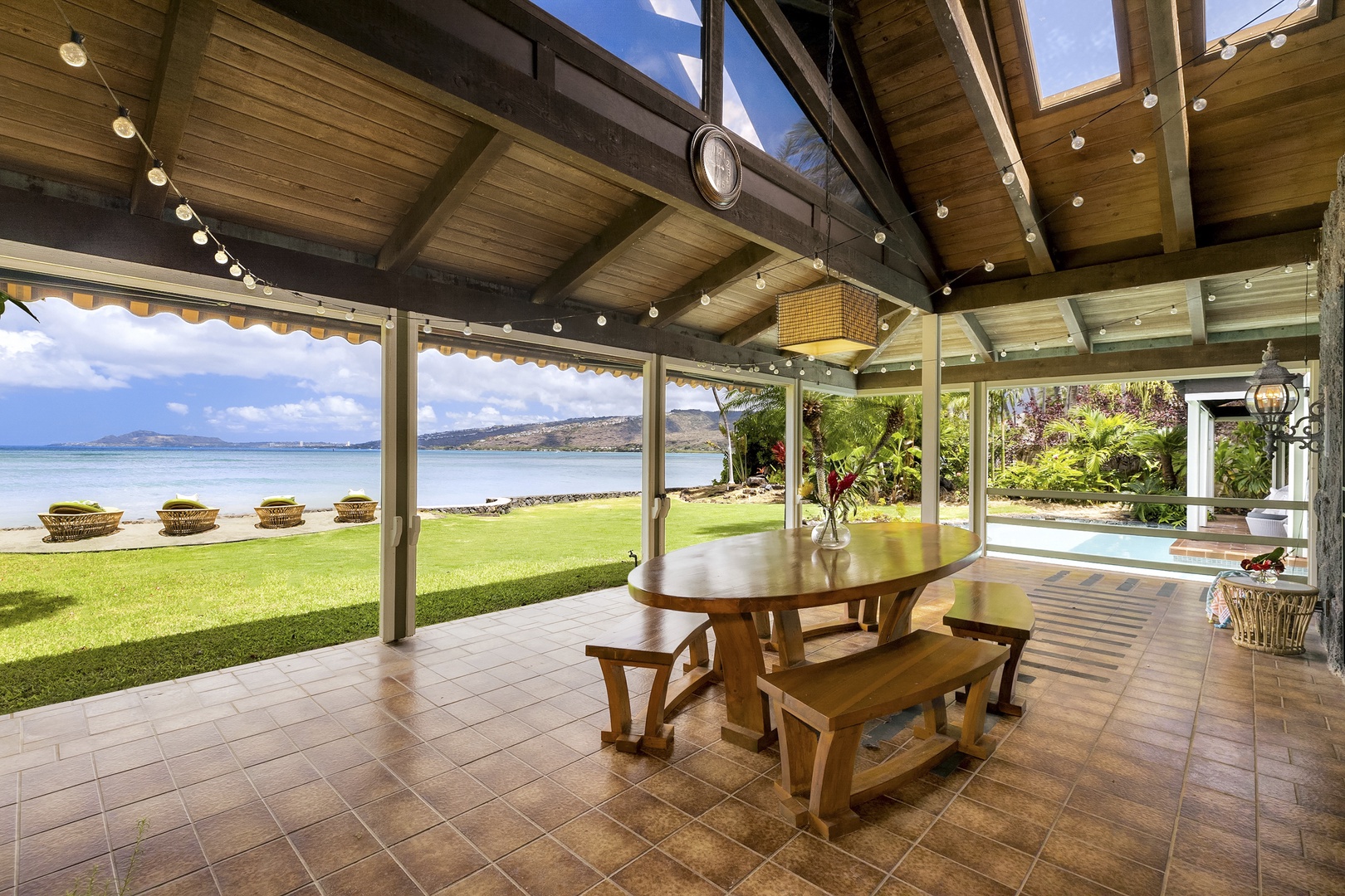 Honolulu Vacation Rentals, Maunalua Sunset - Large Covered Lanai with infront of Living Room with Outdoor Dining.
