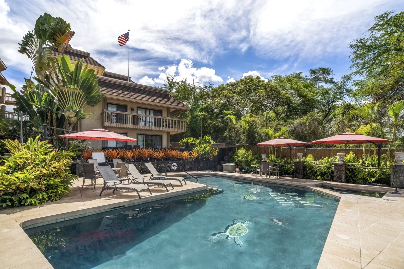 Kailua Kona Vacation Rentals, Royal Kahili 401A - Inviting pool area with ample space and relaxing lounge chairs for soaking in the ambiance.