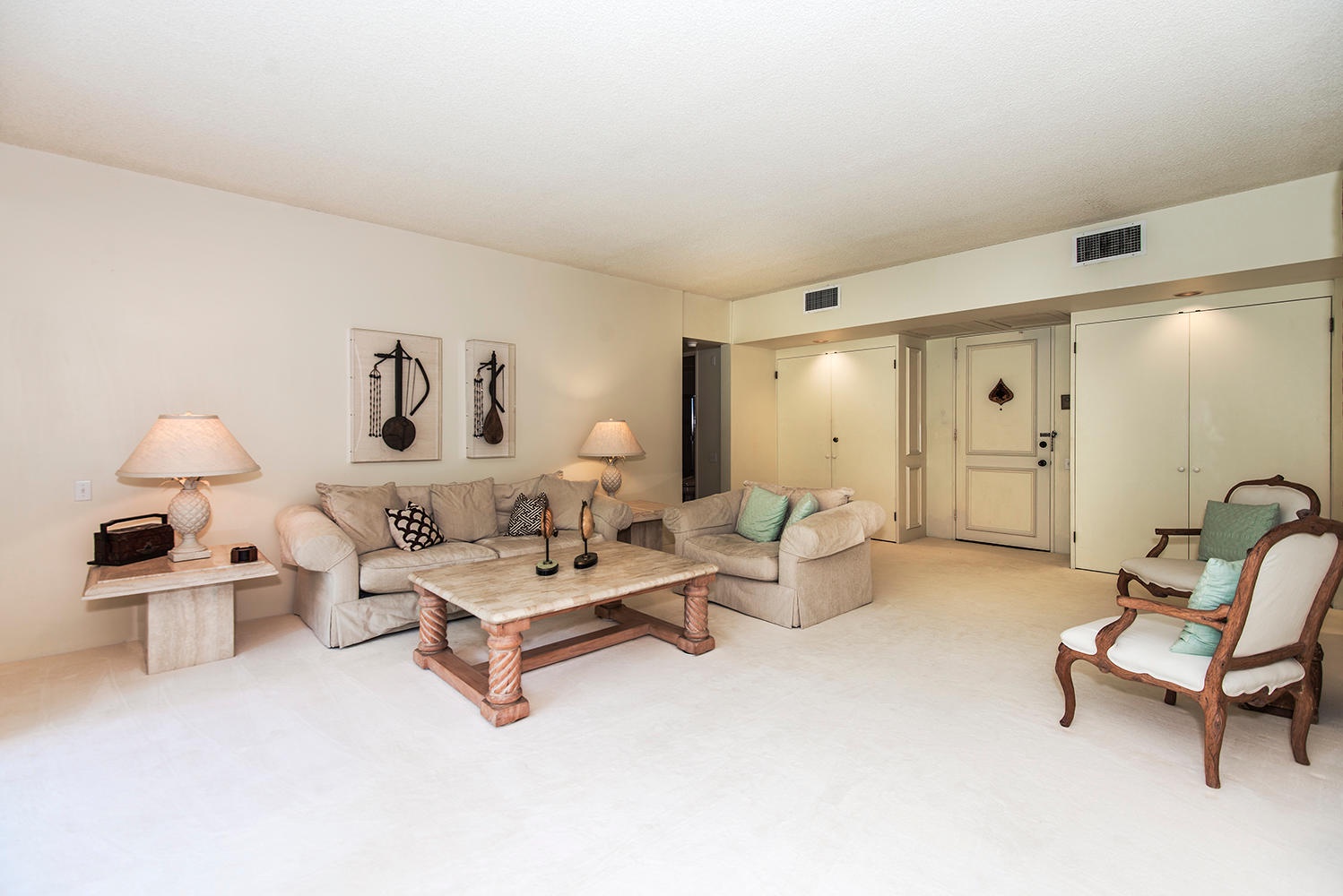 Honolulu Vacation Rentals, Kahala Beachfront Villa - The spacious living area features a seamless indoor-outdoor living with direct access to the balcony.