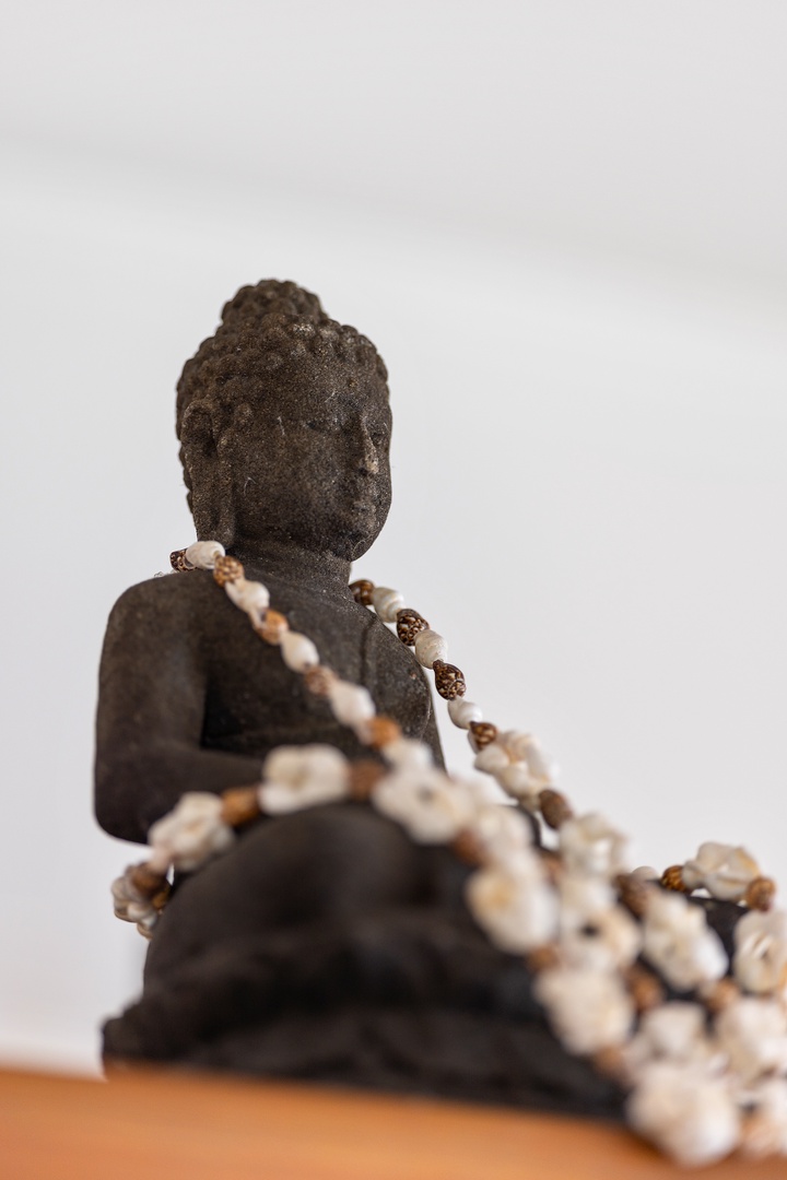 Kapolei Vacation Rentals, Ko Olina Kai 1105E - A serene Buddha statue adorned with prayer beads creates a peaceful meditation corner where you can unwind and center your mind after exploring.