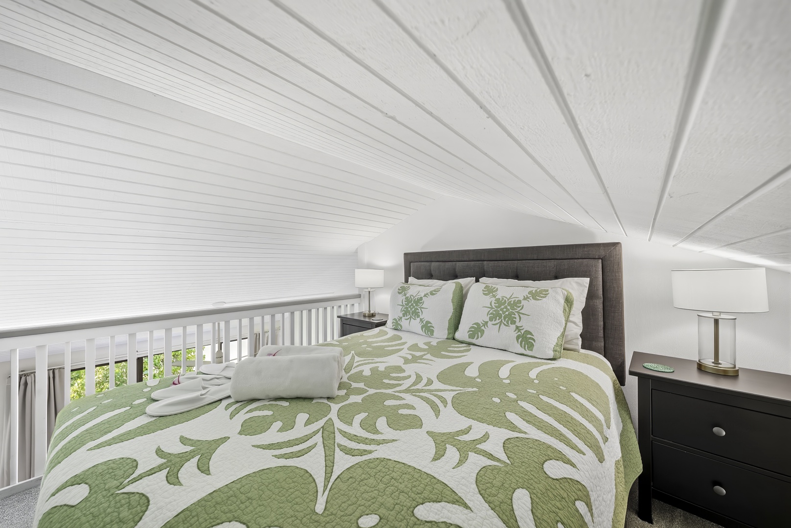 Kahuku Vacation Rentals, Kuilima Estates West #132 - Tucked under the eaves, the queen loft bed makes a snug spot to end the day.