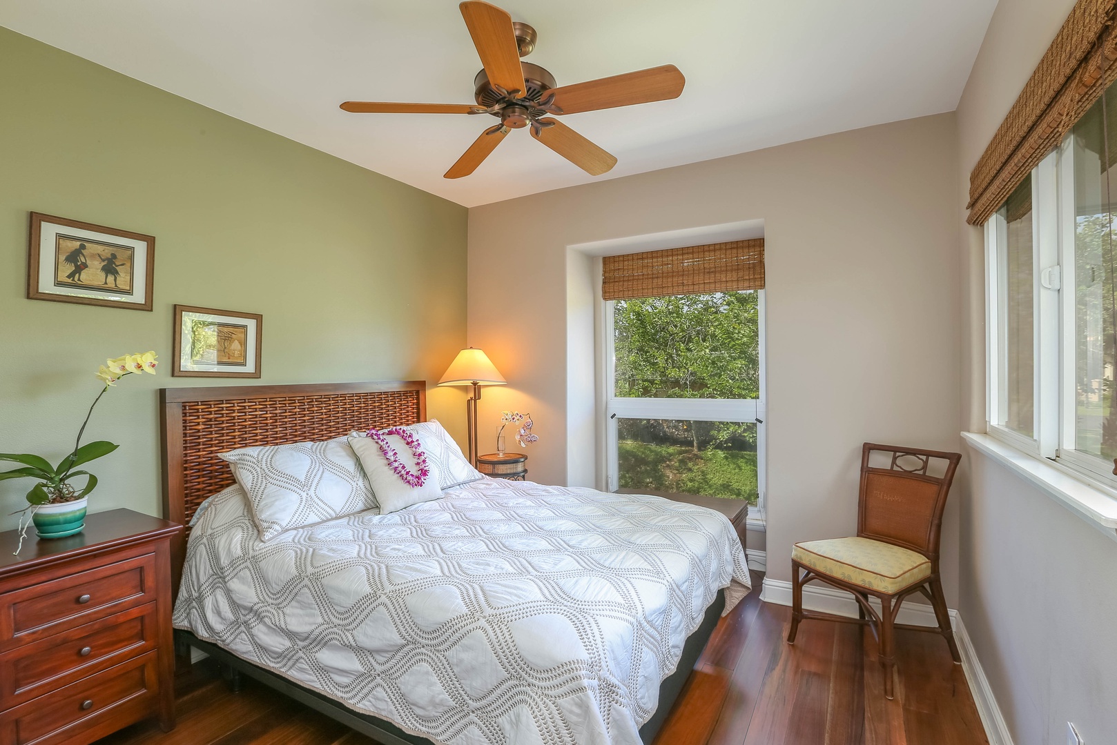 Princeville Vacation Rentals, Nohea Villa - Guest suite featuring a comfortable queen bed and natural light.