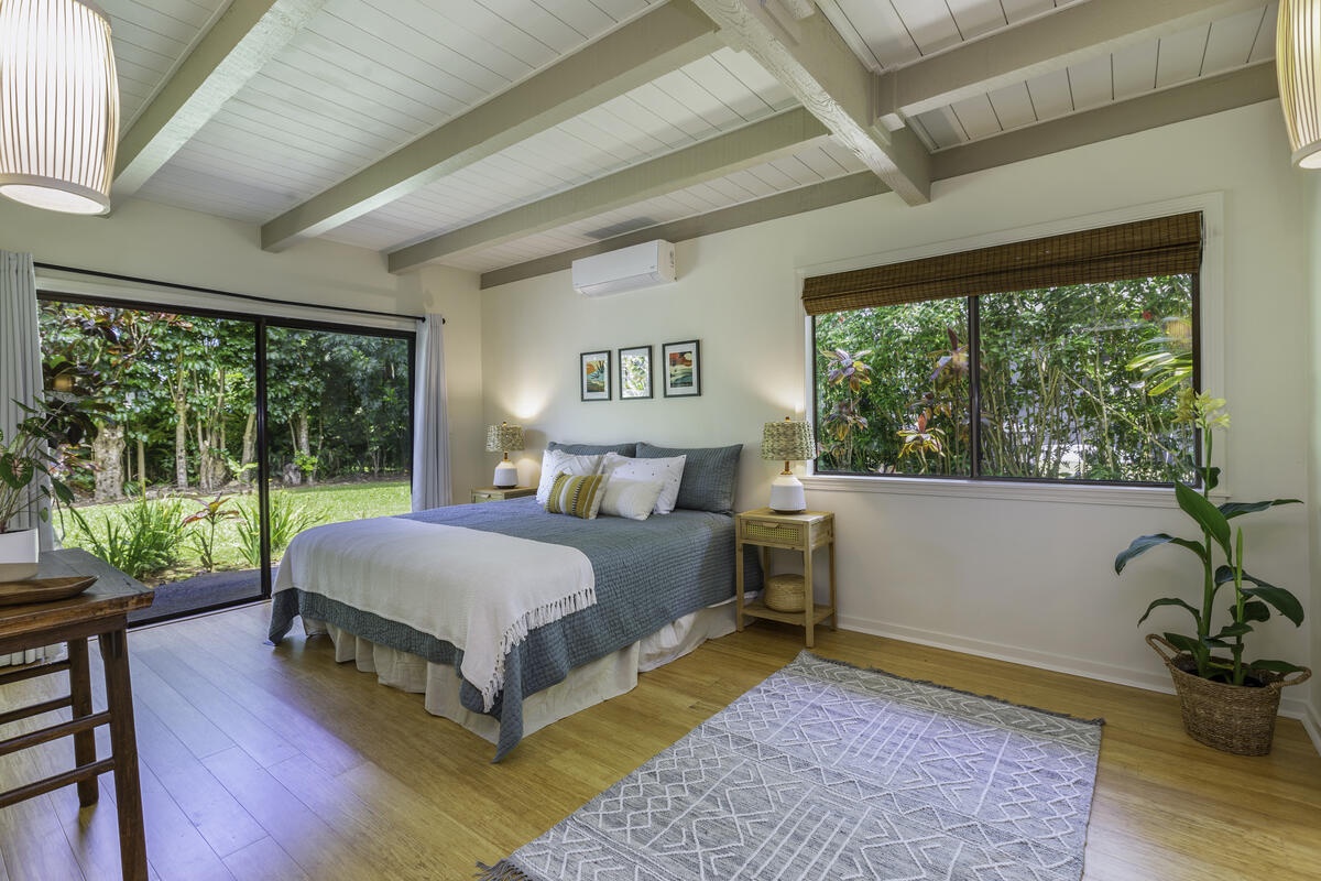 Princeville Vacation Rentals, Hale Kalani - The large bedroom on the lower level has a king bed and direct access to the patio