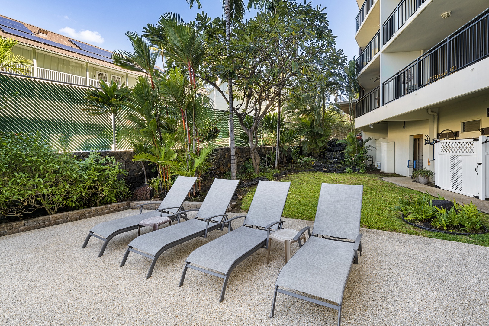 Kailua Kona Vacation Rentals, Kona Alii 201 - Relax on one of many loungers at the common area pool!