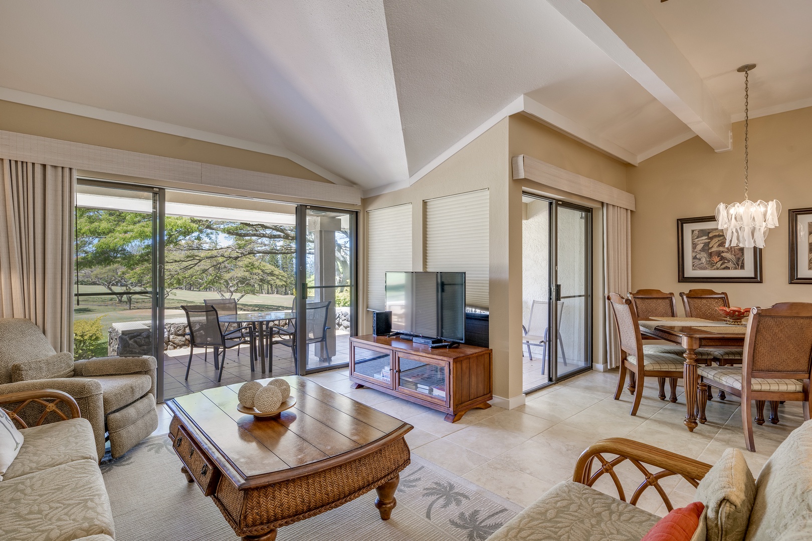Lahaina Vacation Rentals, Kapalua Golf Villas 14P1-2 - Comfortable living room with ceiling fan and TV, ideal for movie nights after beach days. Equipped with a sleeper sofa.