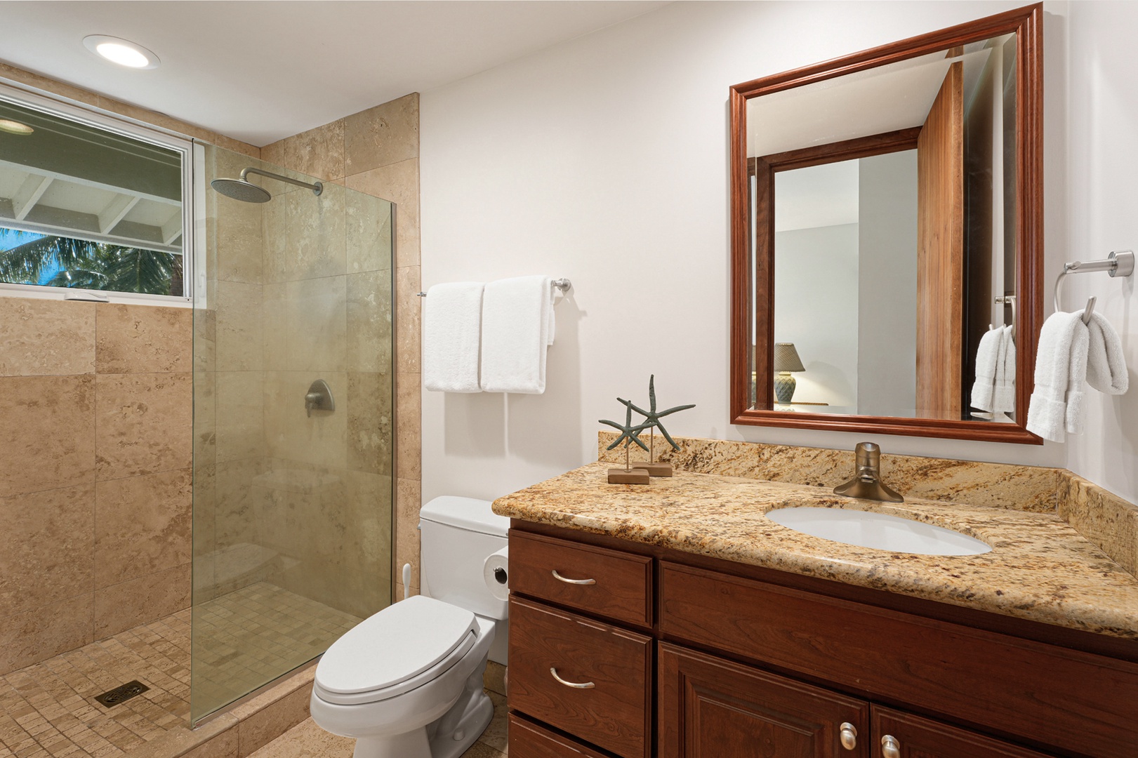 Koloa Vacation Rentals, Whalers Cove #133 - Guest bathroom with a spacious vanity, walk-in shower, and modern finishes