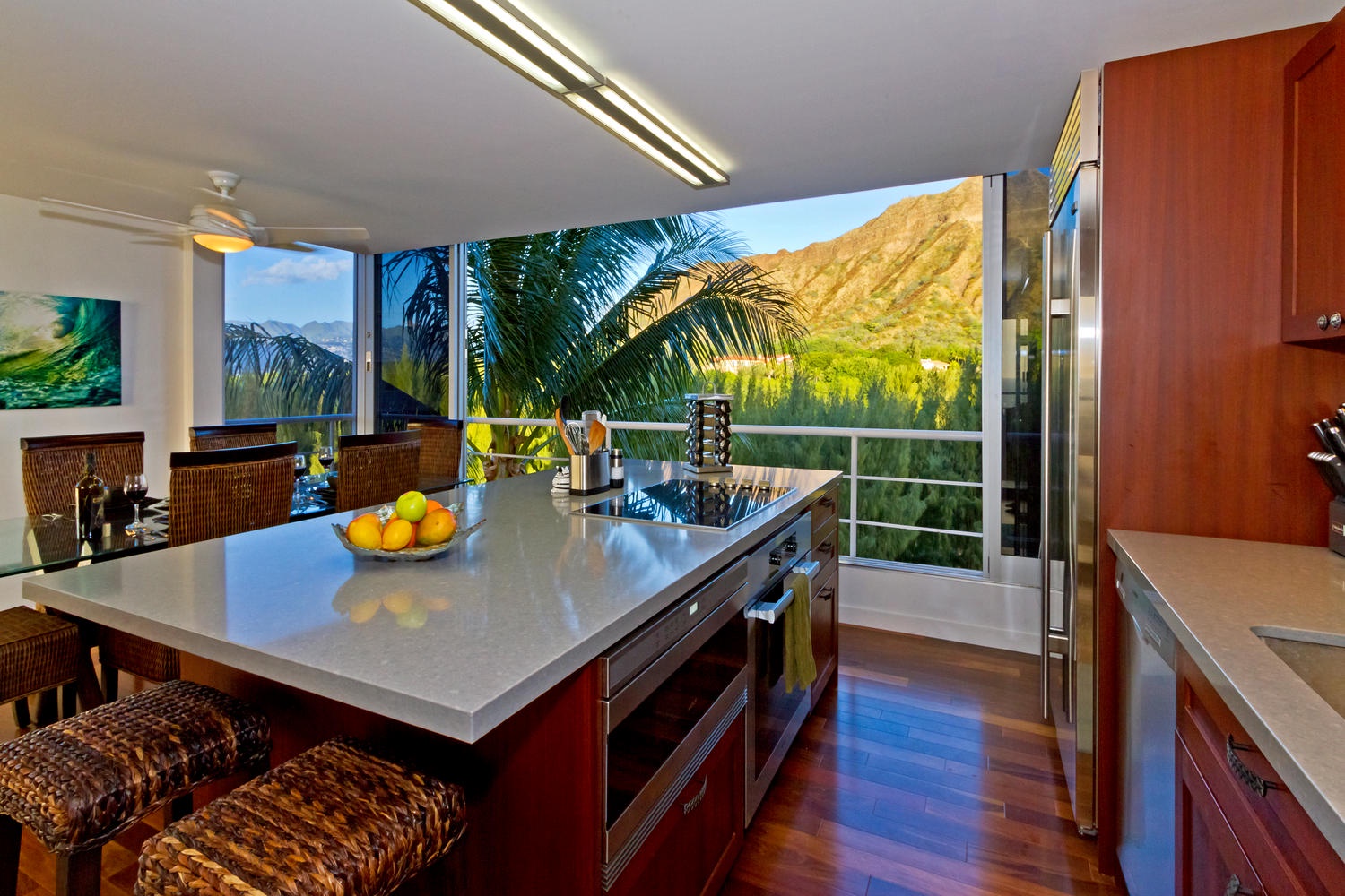 Honolulu Vacation Rentals, Executive Gold Coast Oceanfront Suite - Full gourmet kitchen with stainless steel appliances, including refrigerator, dishwasher, microwave, stove, oven, wine cooler, and trash compactor.