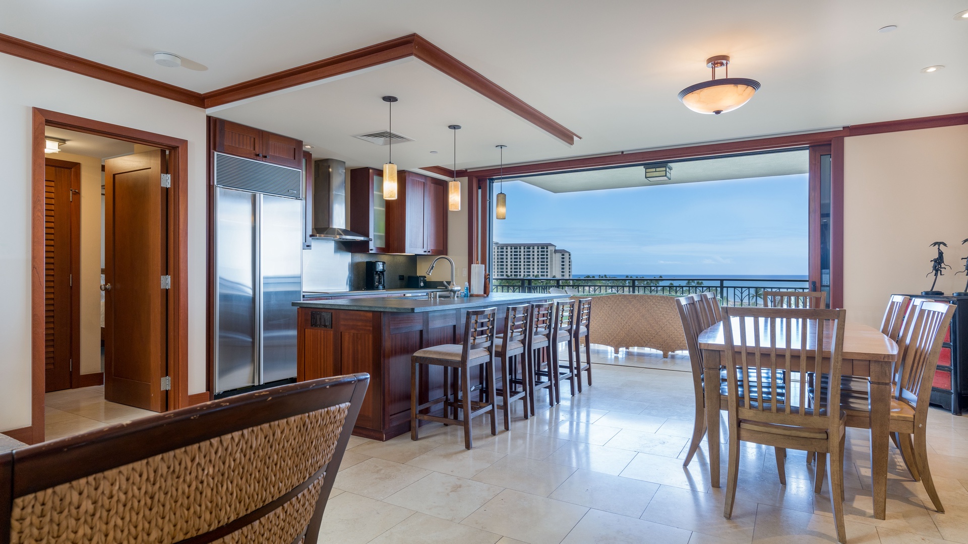 Kapolei Vacation Rentals, Ko Olina Beach Villas B701 - The open floor plan with bar seating in the kitchen and dining that seats eight.