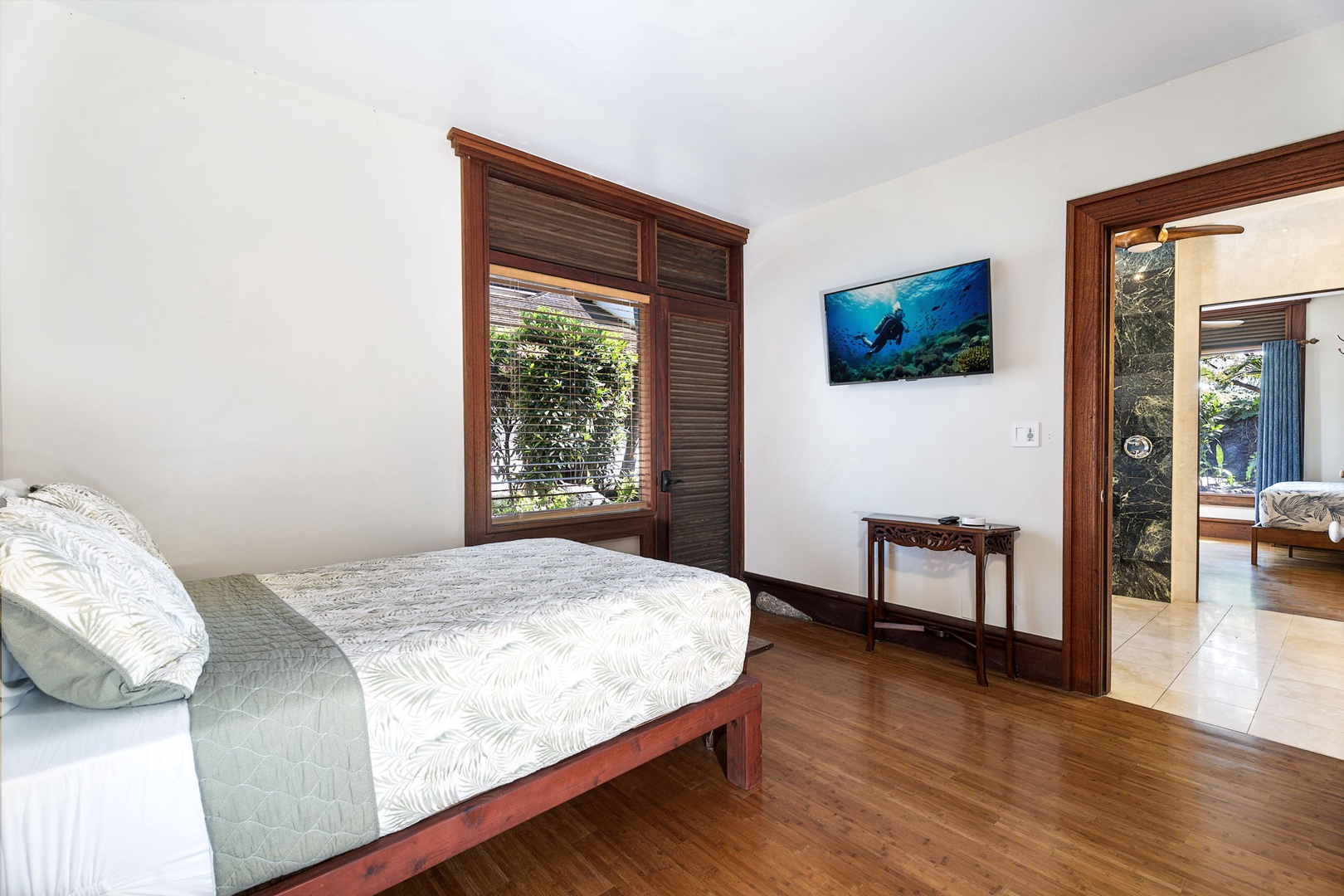 Kailua-Kona Vacation Rentals, Hahalua Bay Villa - Sink into your cozy tropical bed with calming sea-green linens and rich wood accents creating the perfect island retreat.