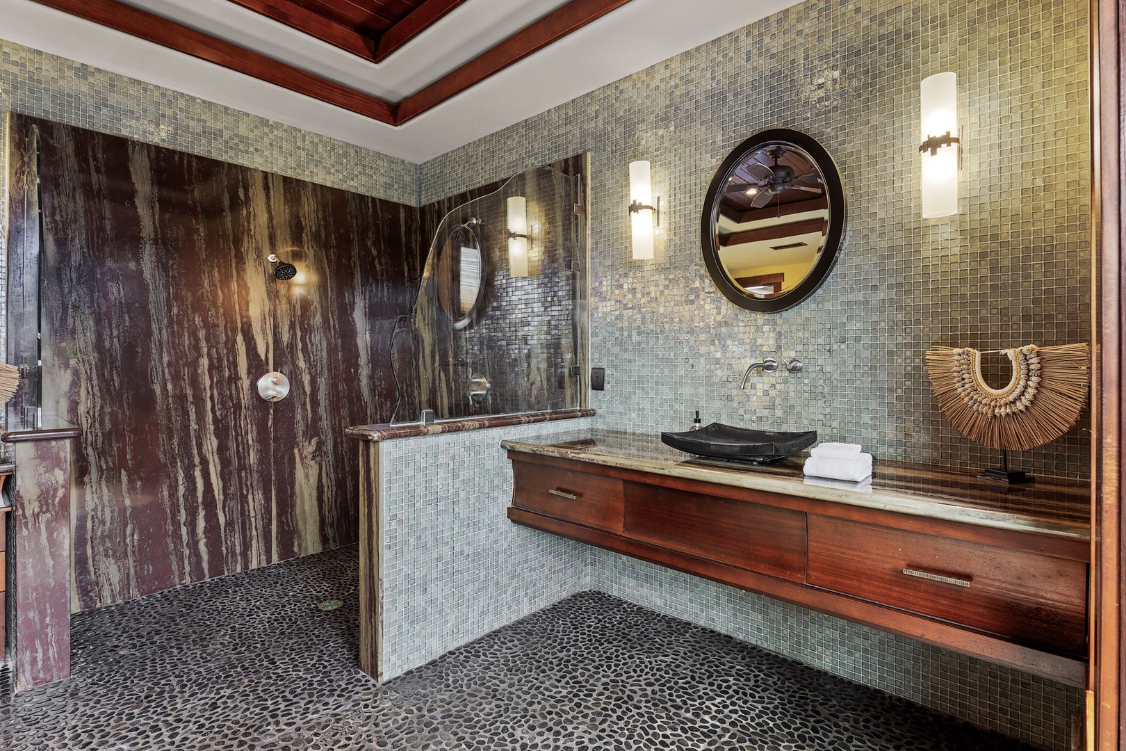 Kamuela Vacation Rentals, Hale Konane - Sophisticated ensuite bathroom with modern finishes, double vanity, and a serene rain-style shower.