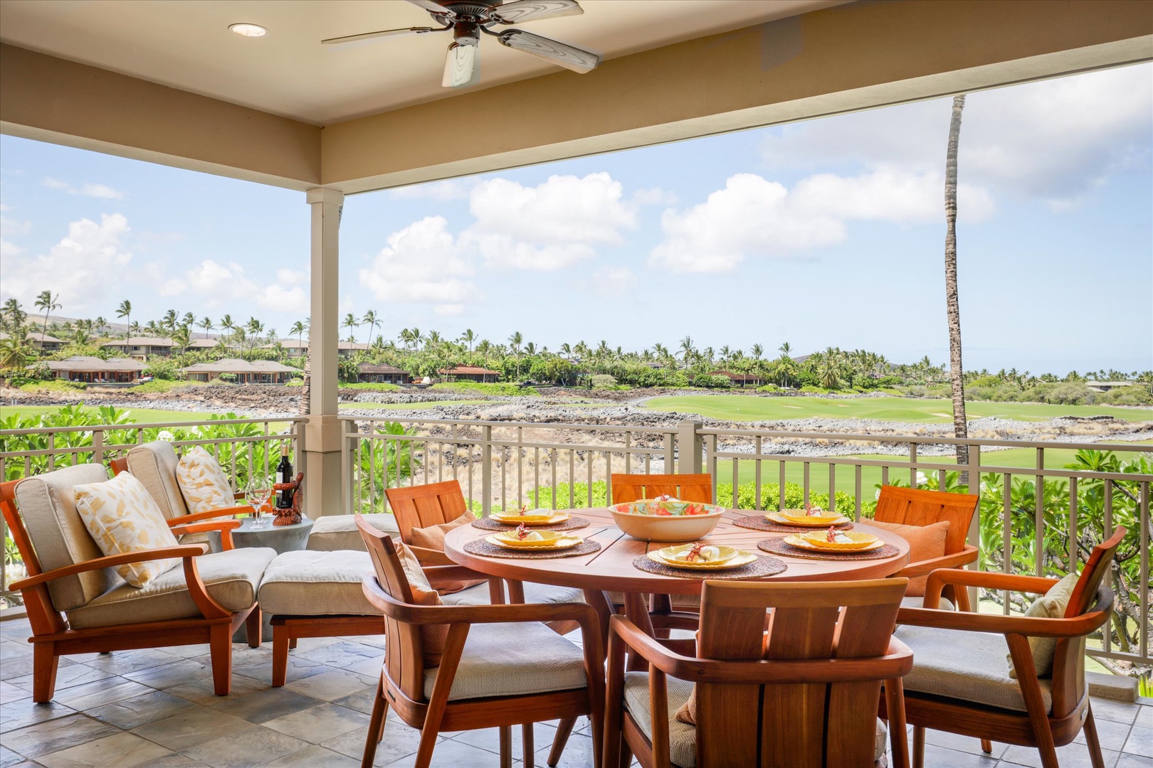 Kailua Kona Vacation Rentals, Wai'ulu Villa 115D - Dine al fresco with views of the golf course and swaying palms under the shaded lanai ceiling.