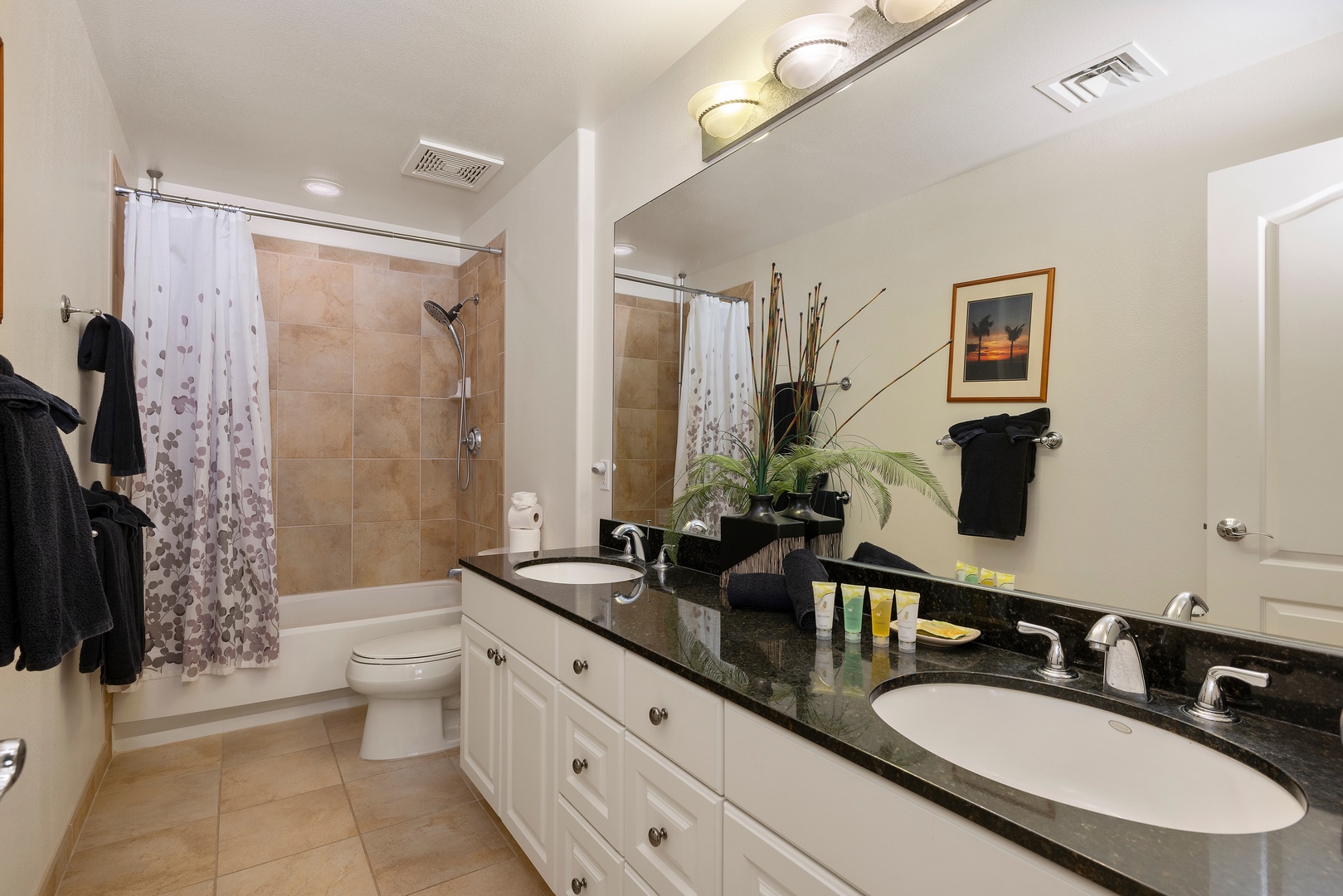 Kapolei Vacation Rentals, Ko Olina Kai 1105E - Your private spa-like bathroom awaits with a soaking tub, spacious granite countertop, and soft towels ready for ultimate relaxation after a day of adventure.