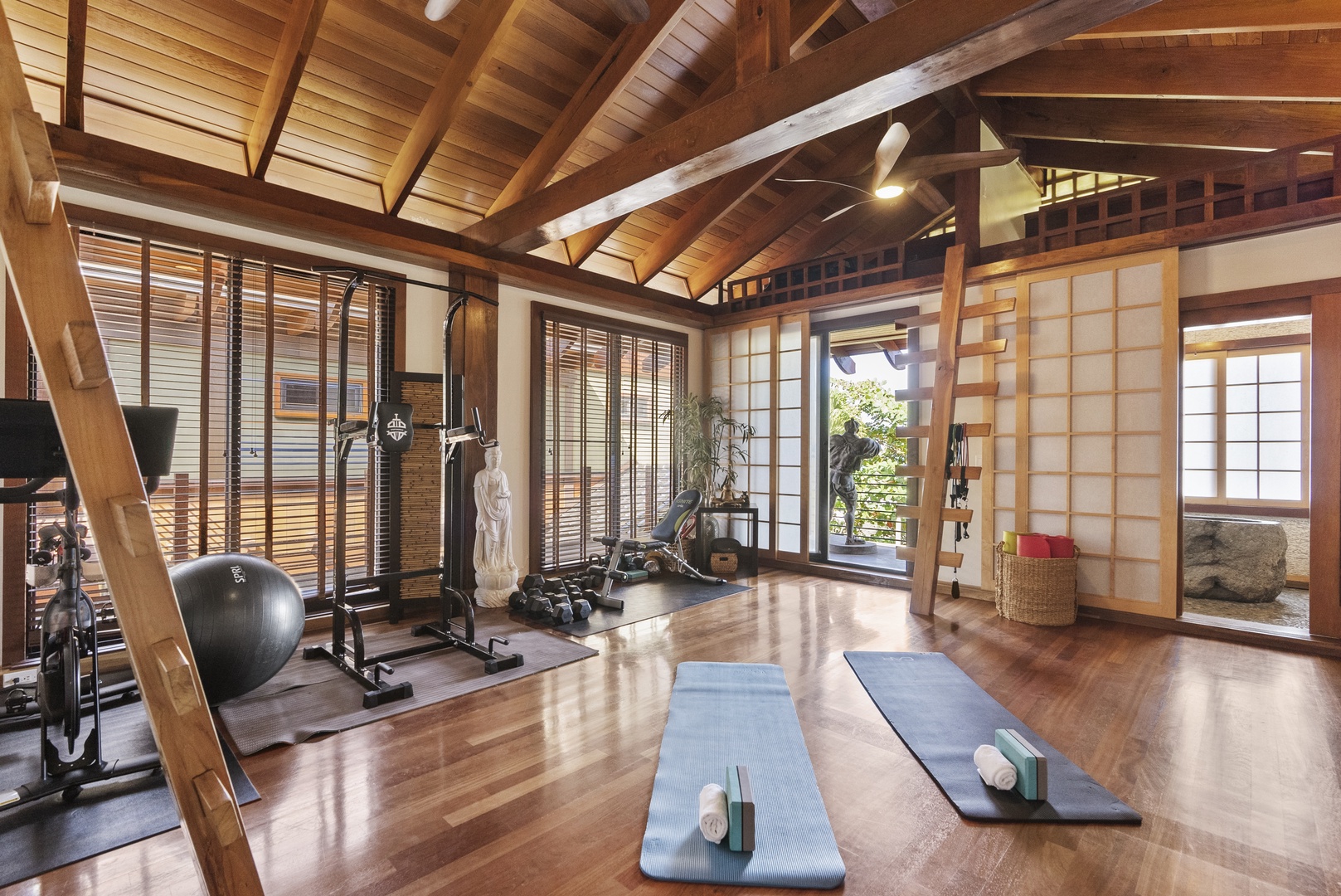 Haleiwa Vacation Rentals, Samurai House - Private dojo  with yoga mats and floor-to-ceiling windows overlooking lush greenery.