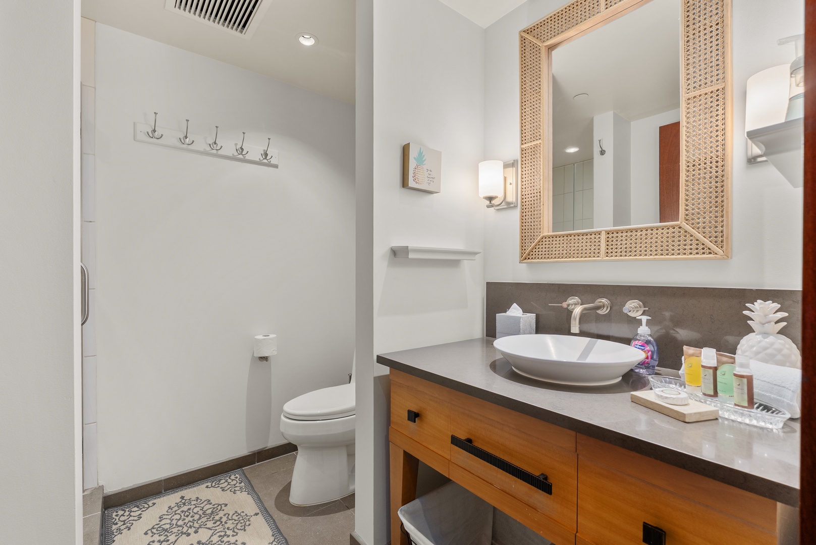A spacious vanity and well-appointed bathroom offer a comfortable spot to refresh.