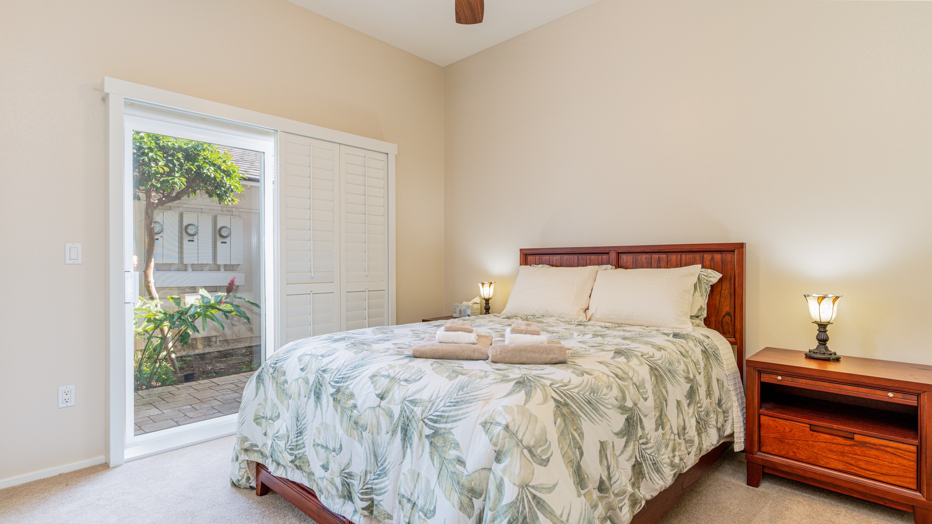 Kapolei Vacation Rentals, Coconut Plantation 1234-2 - The guest bedroom on the first floor has access to the private lanai.