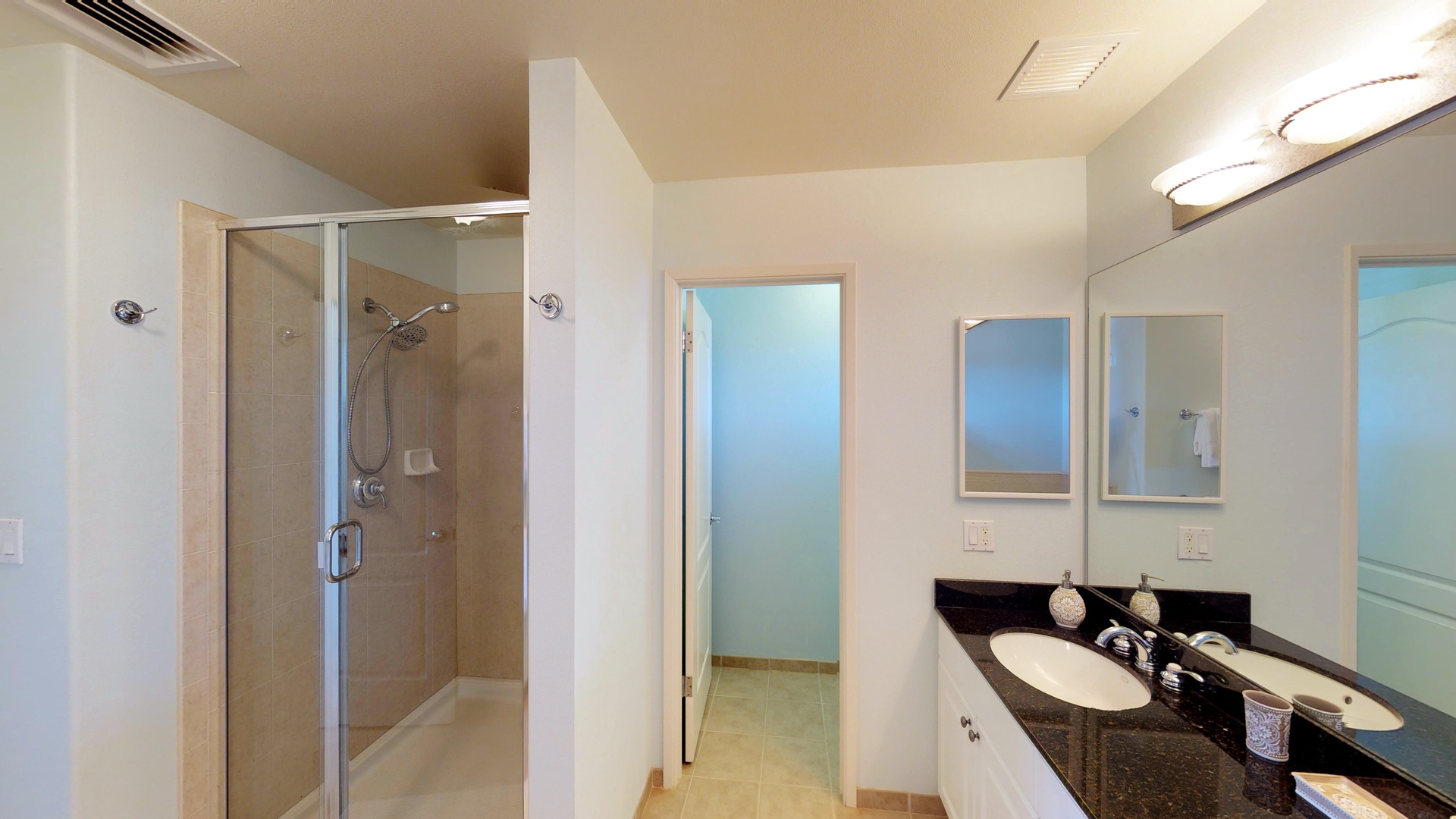 Kapolei Vacation Rentals, Ko Olina Kai 1035D - The large primary guest bathroom with a walk-in shower and double vanity.