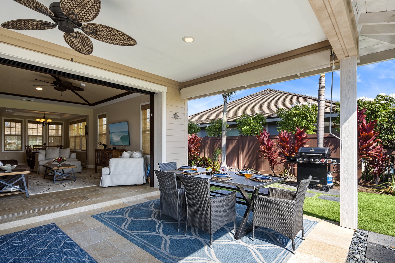 Kailua Kona Vacation Rentals, Kona Blue Vacations Holua Kai - Covered lanai at Kona Blue Vacations Holua Kai offers outdoor seating for shaded meals and cool evening breezes.